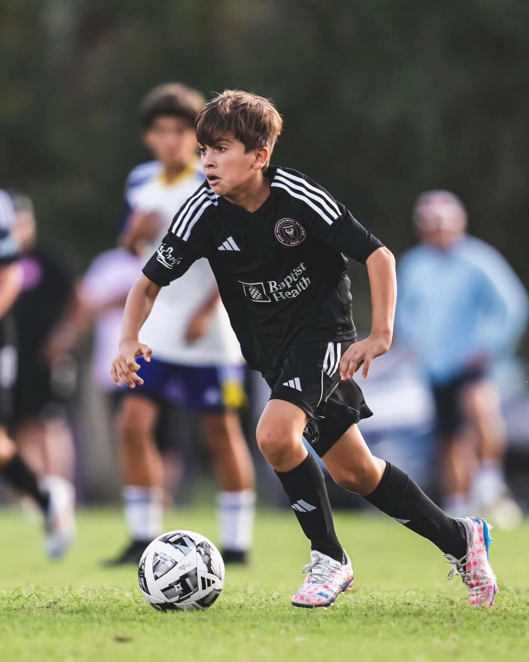 A thoughtful portrait of a 13-year-old boy with a footballing legacy, reflecting the balance between public attention and everyday family life