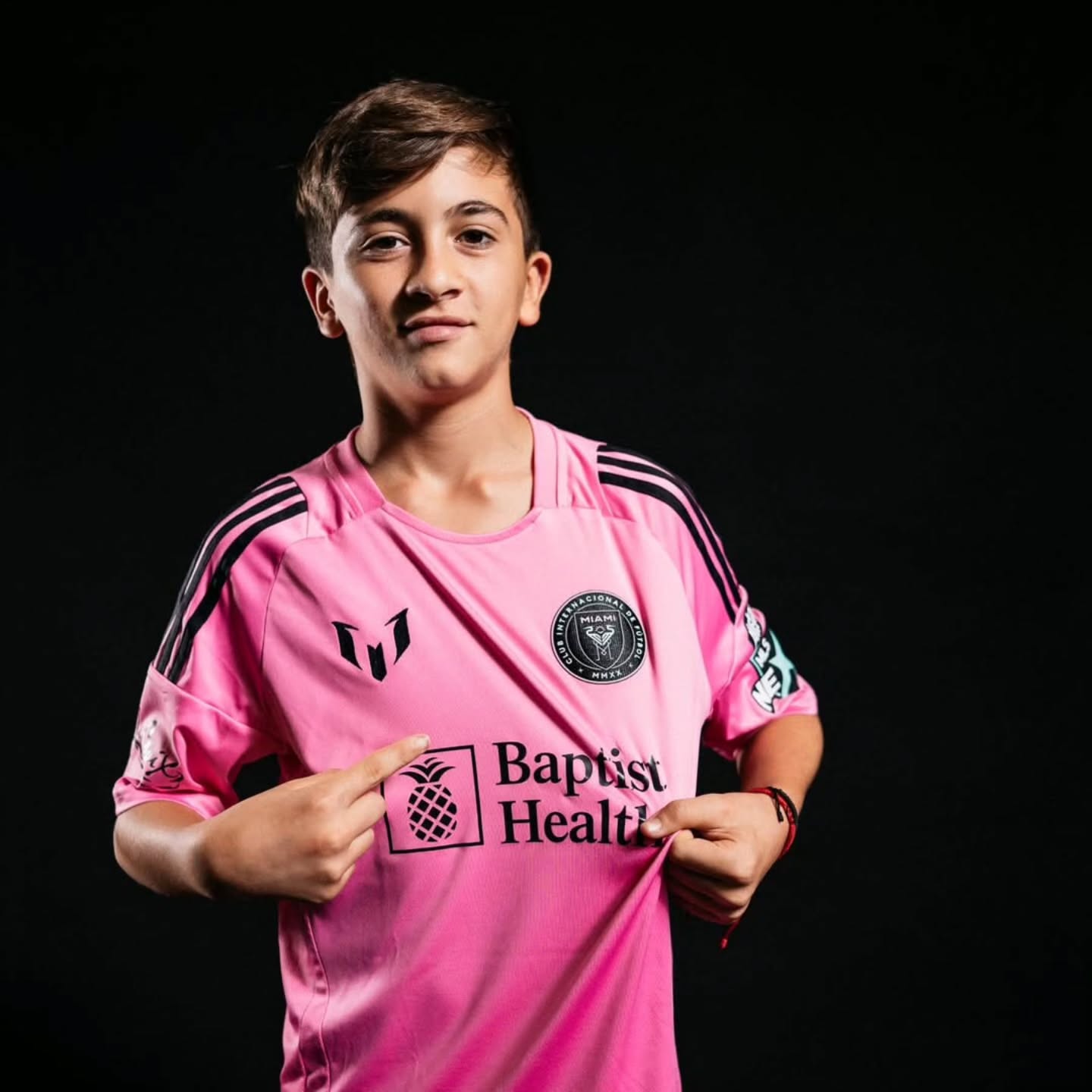 A thoughtful portrait of a 13-year-old boy with a footballing legacy, reflecting the balance between public attention and everyday family life