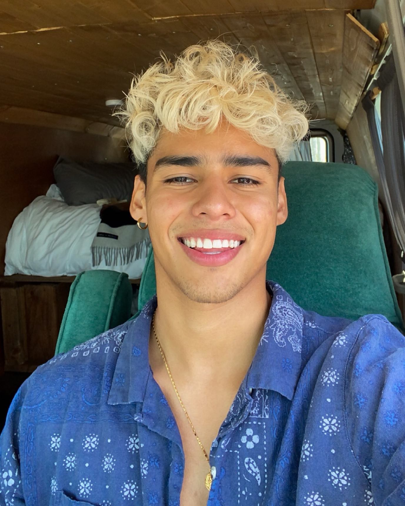 Andrew Davila in a relaxed pose, casual outfit, natural lighting, conveying an approachable and authentic style.