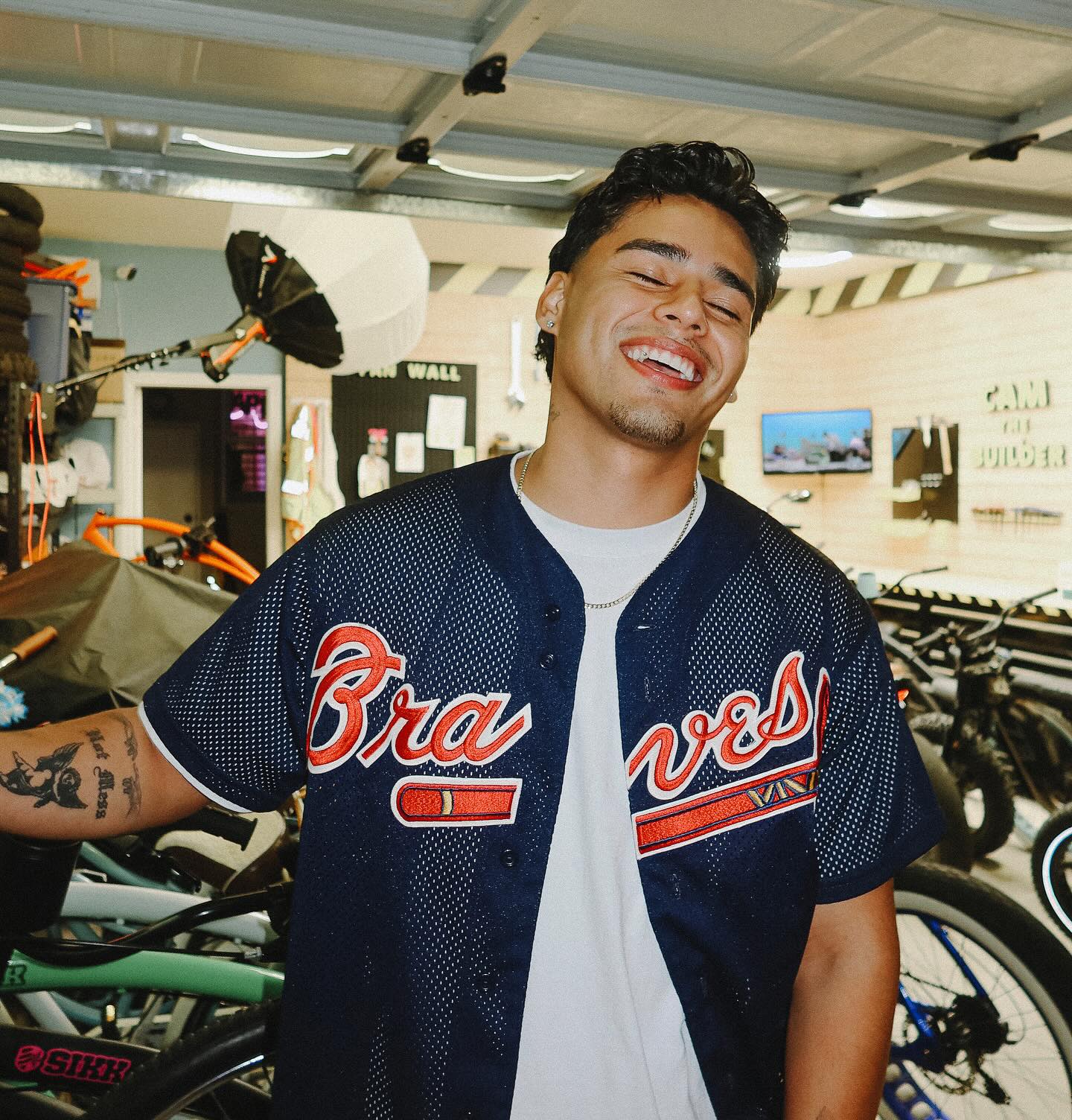 Andrew Davila in a relaxed pose, casual outfit, natural lighting, conveying an approachable and authentic style.