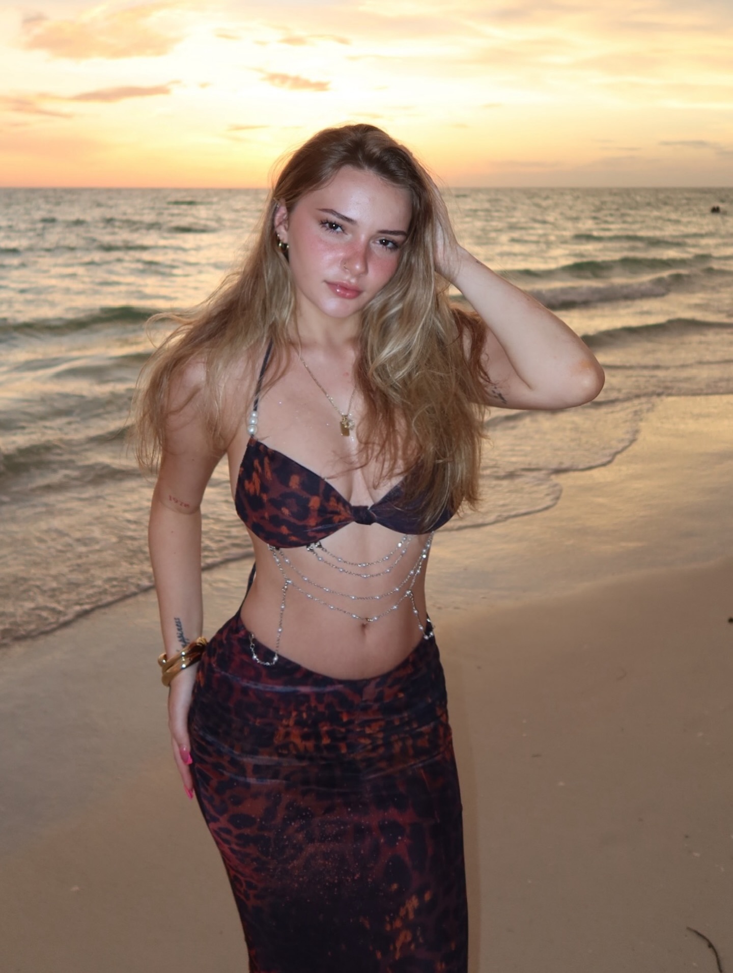 Ava Reyes wearing bold, high-contrast makeup while filming a short-form video and holding an iced coffee prop