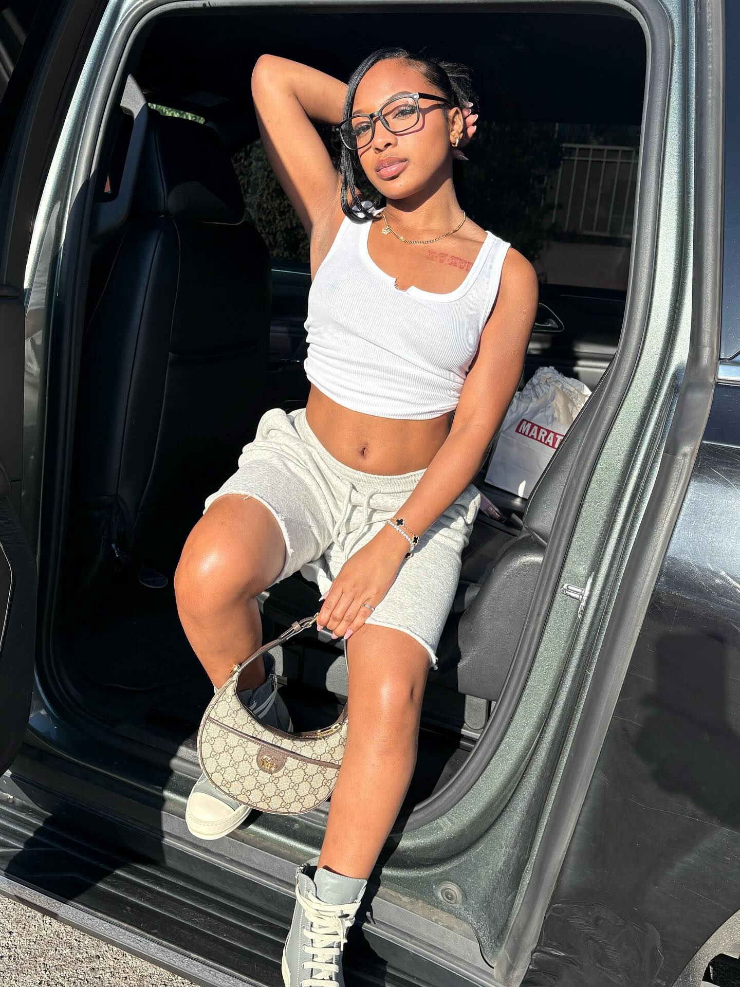 Brooklyn Frost smiling while filming a casual vlog at home, conveying a playful and confident on-camera presence