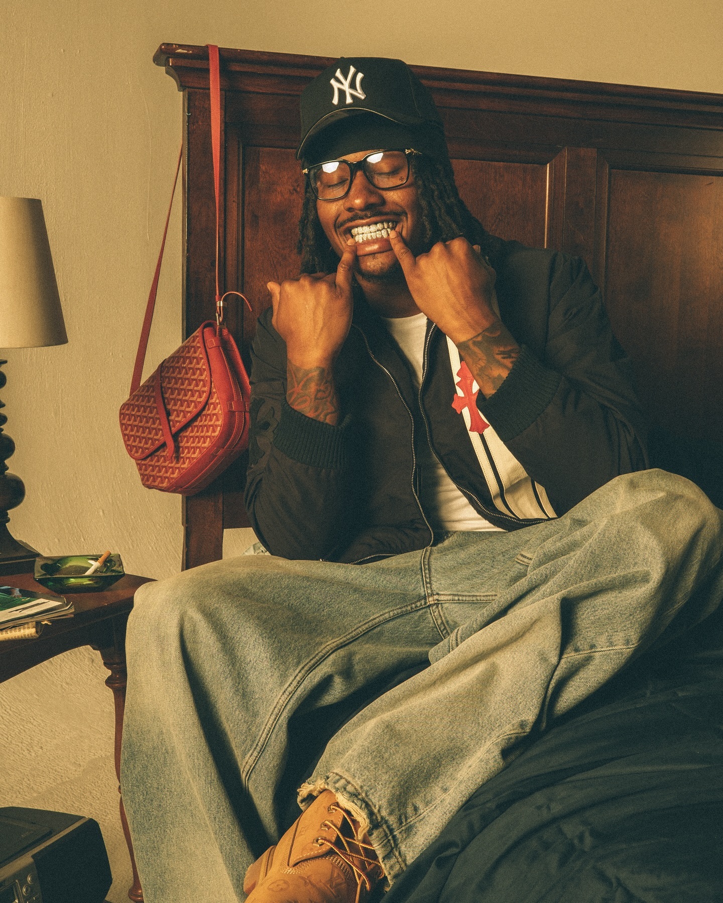 Duke Dennis recording NBA 2K content at a gaming setup, smiling and speaking to the camera