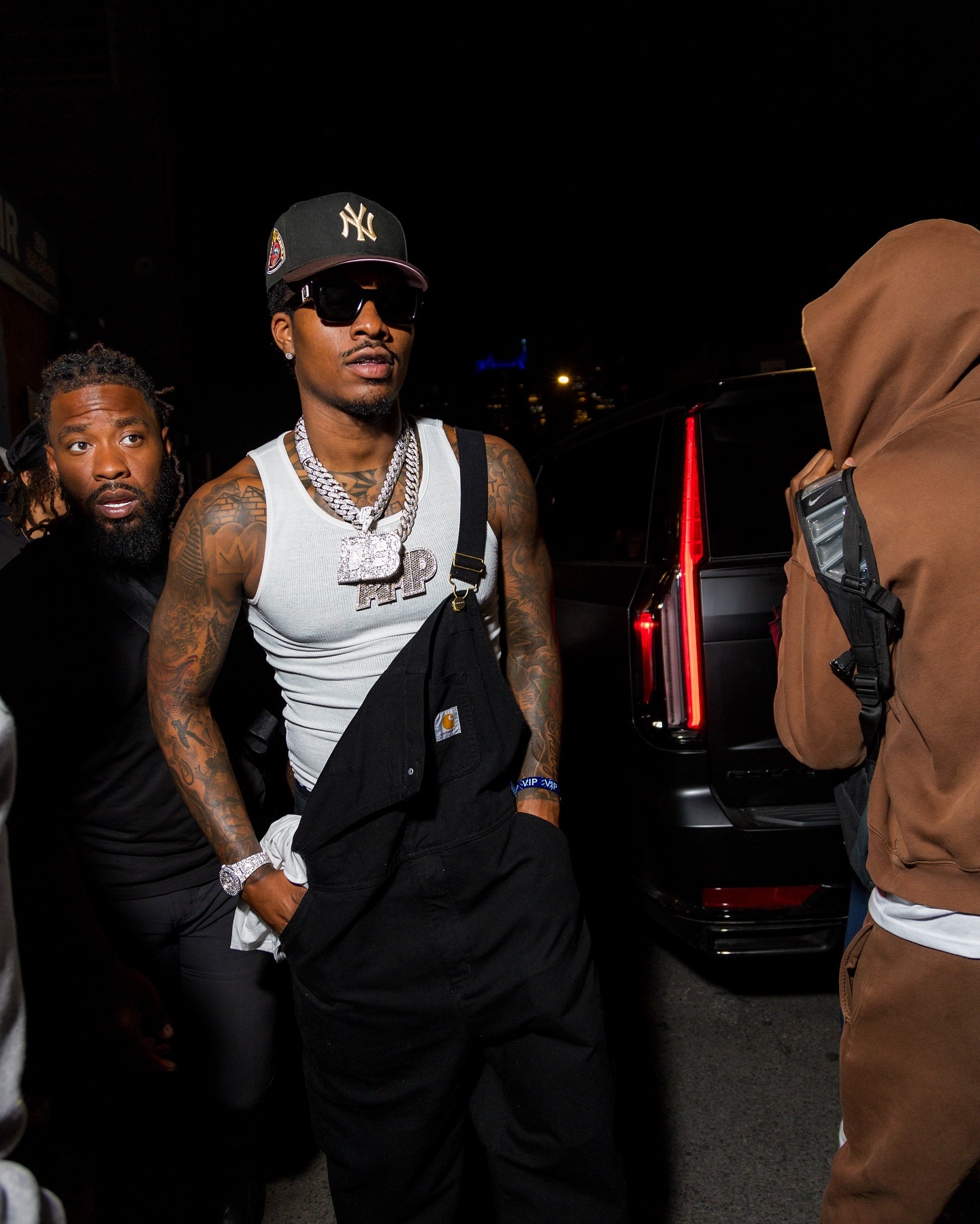 Duke Dennis recording NBA 2K content at a gaming setup, smiling and speaking to the camera