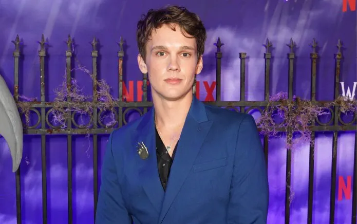 Fielder Jewett on a quiet film set, reviewing notes with a thoughtful expression