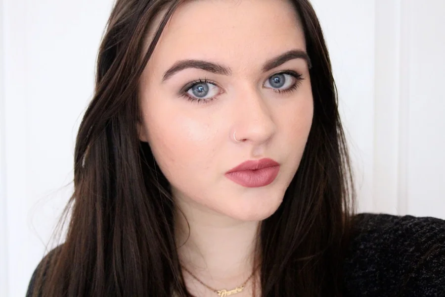 Georgia Marie Thompson at a high profile event, poised and elegantly dressed, facing the camera with a confident expression