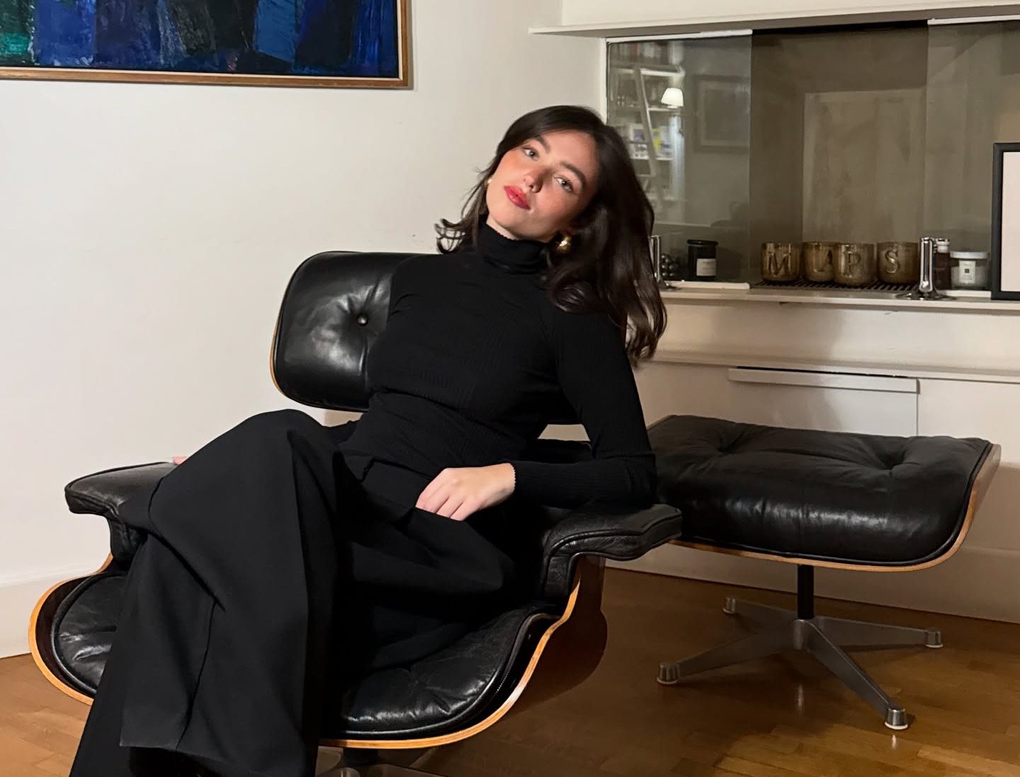 Gio Scotti performing a lip sync on camera with expressive gestures and a clean, minimalist background