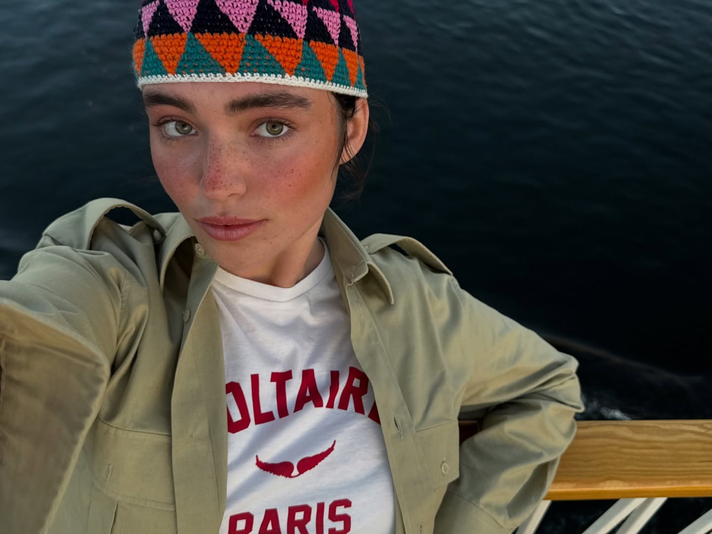 Gio Scotti performing a lip sync on camera with expressive gestures and a clean, minimalist background