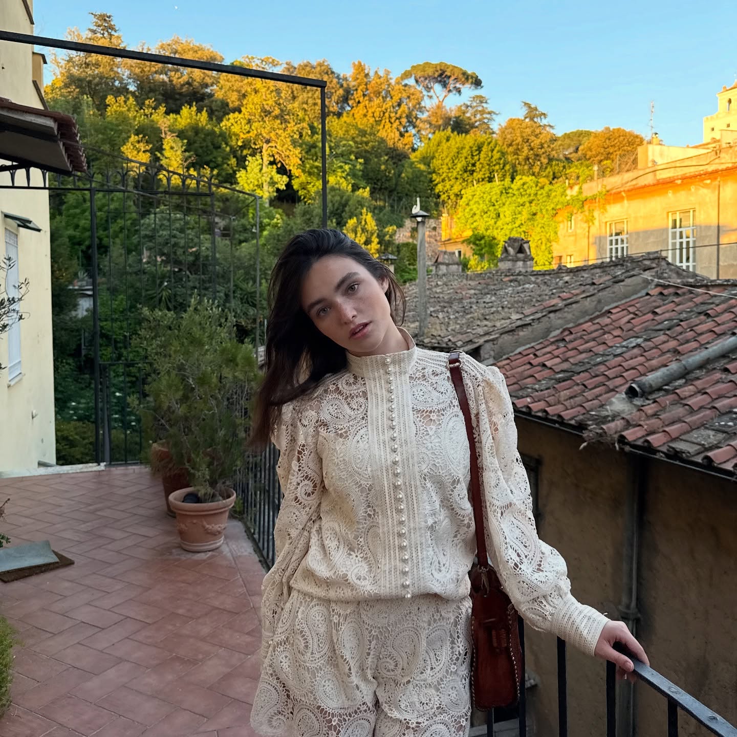 Gio Scotti performing a lip sync on camera with expressive gestures and a clean, minimalist background