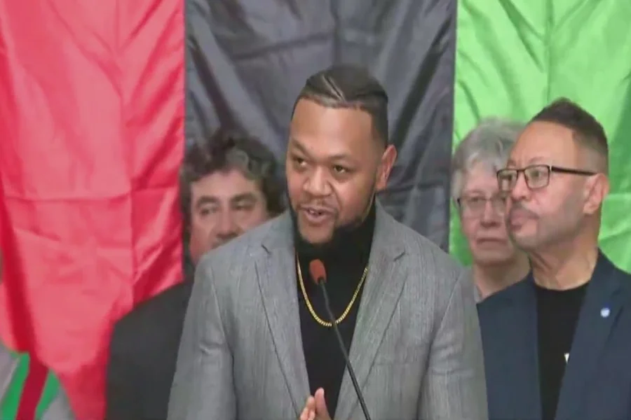 Portrait style image of Glenn Marshall at a public event, dressed elegantly with a confident expression.