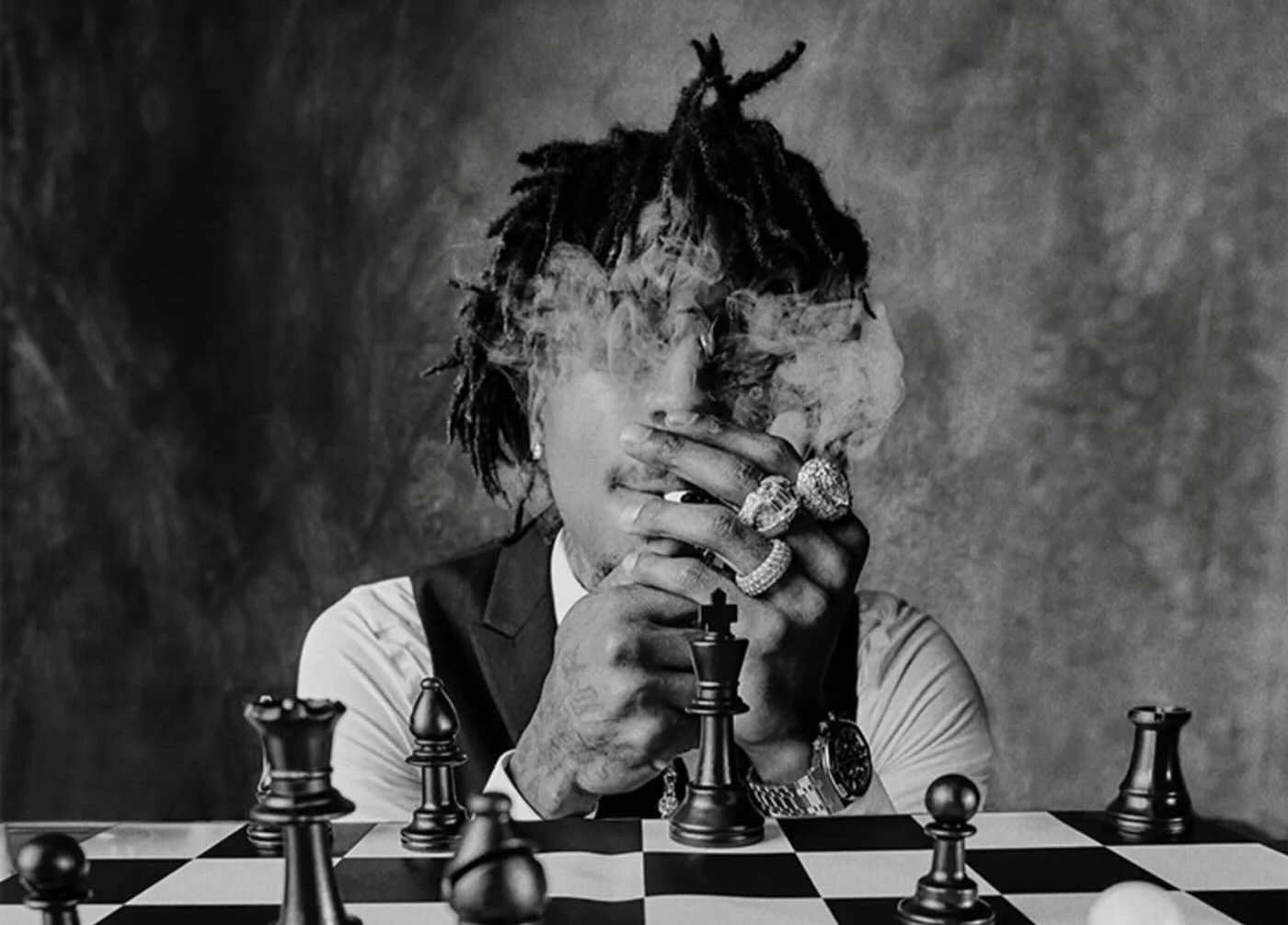 NBA YoungBoy performing on stage with expressive energy, capturing the intensity and emotion that define his music.