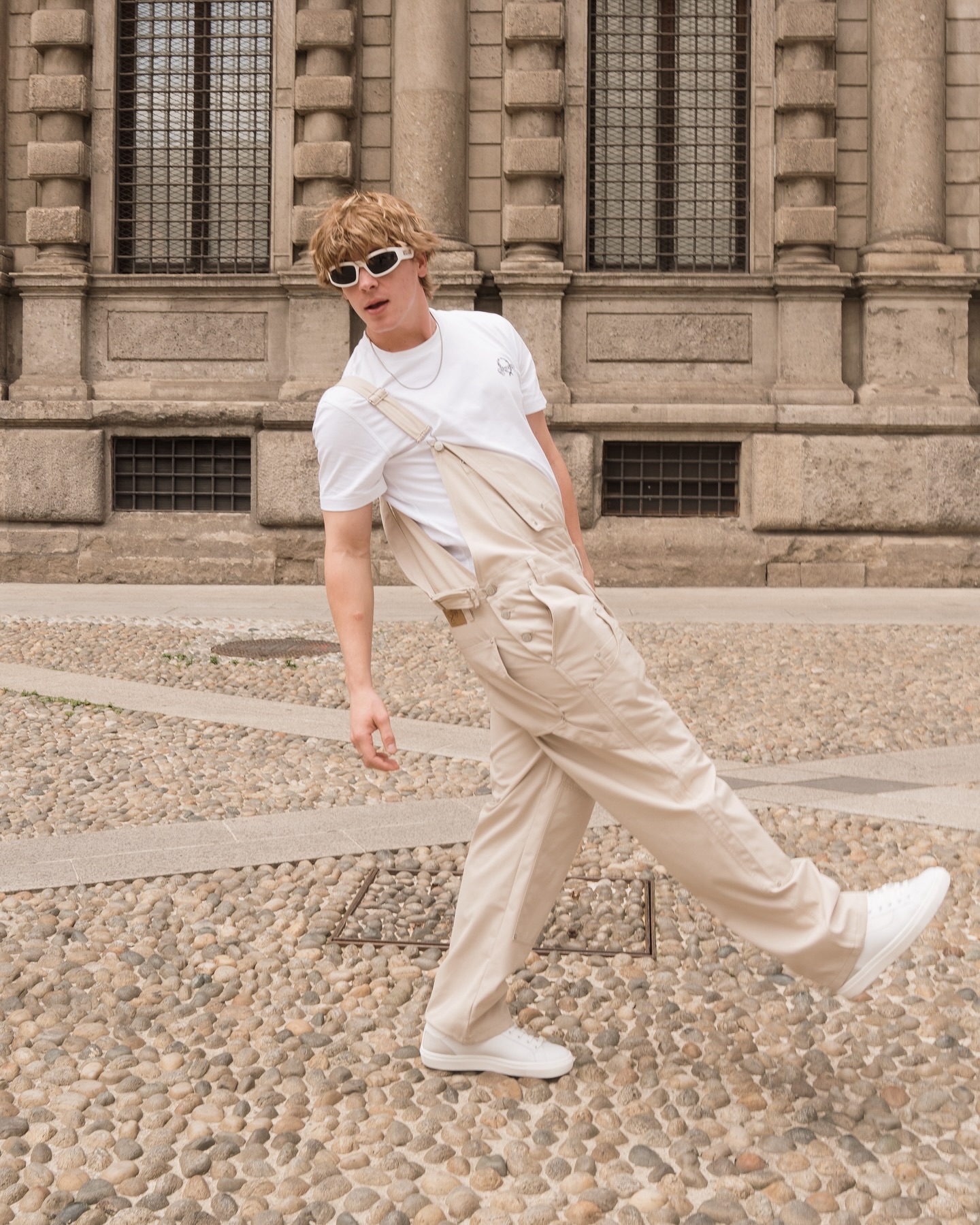 Jack Wright performing an expressive dance move on a minimalist set, capturing his athletic style and reflective tone