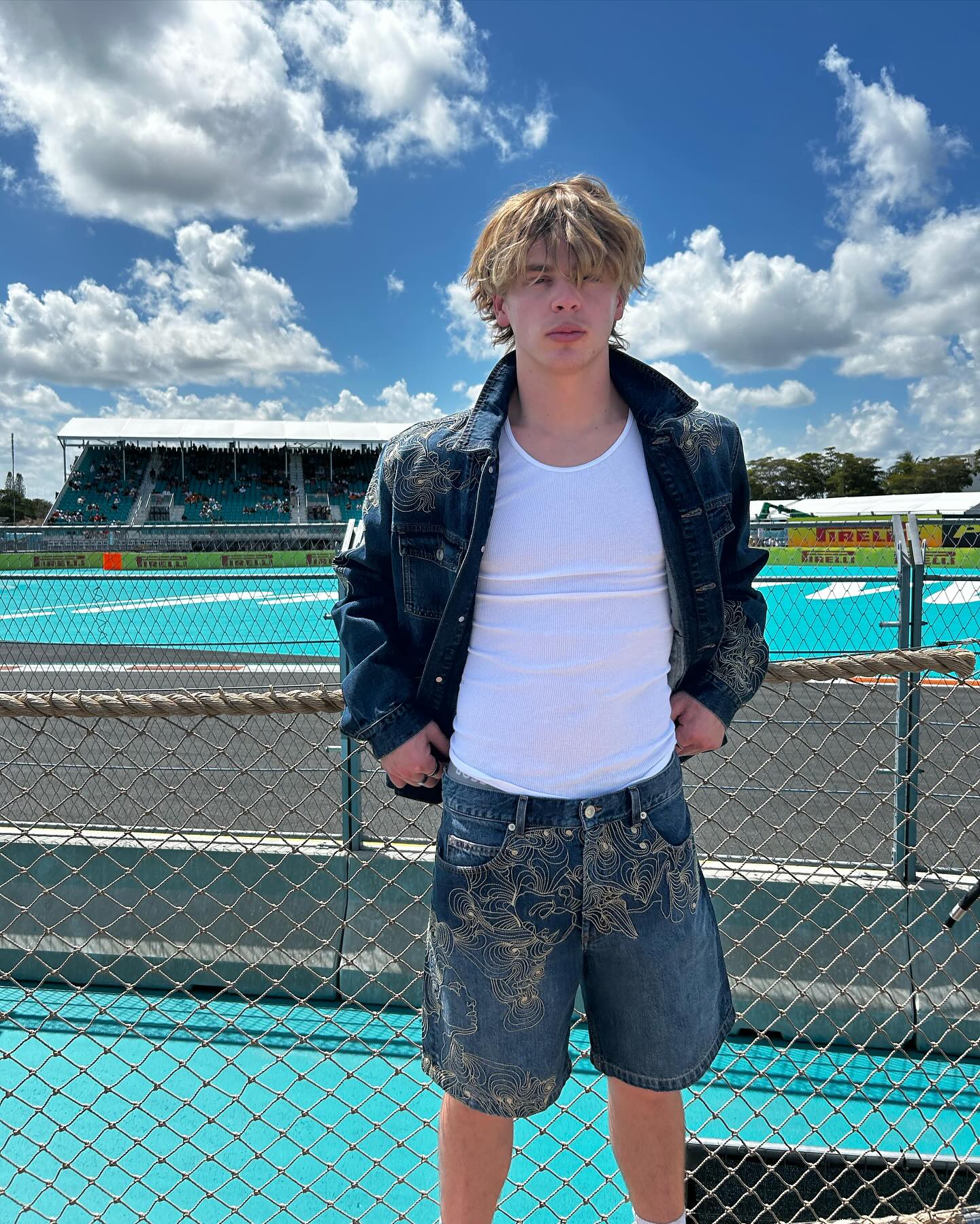 Jack Wright performing an expressive dance move on a minimalist set, capturing his athletic style and reflective tone