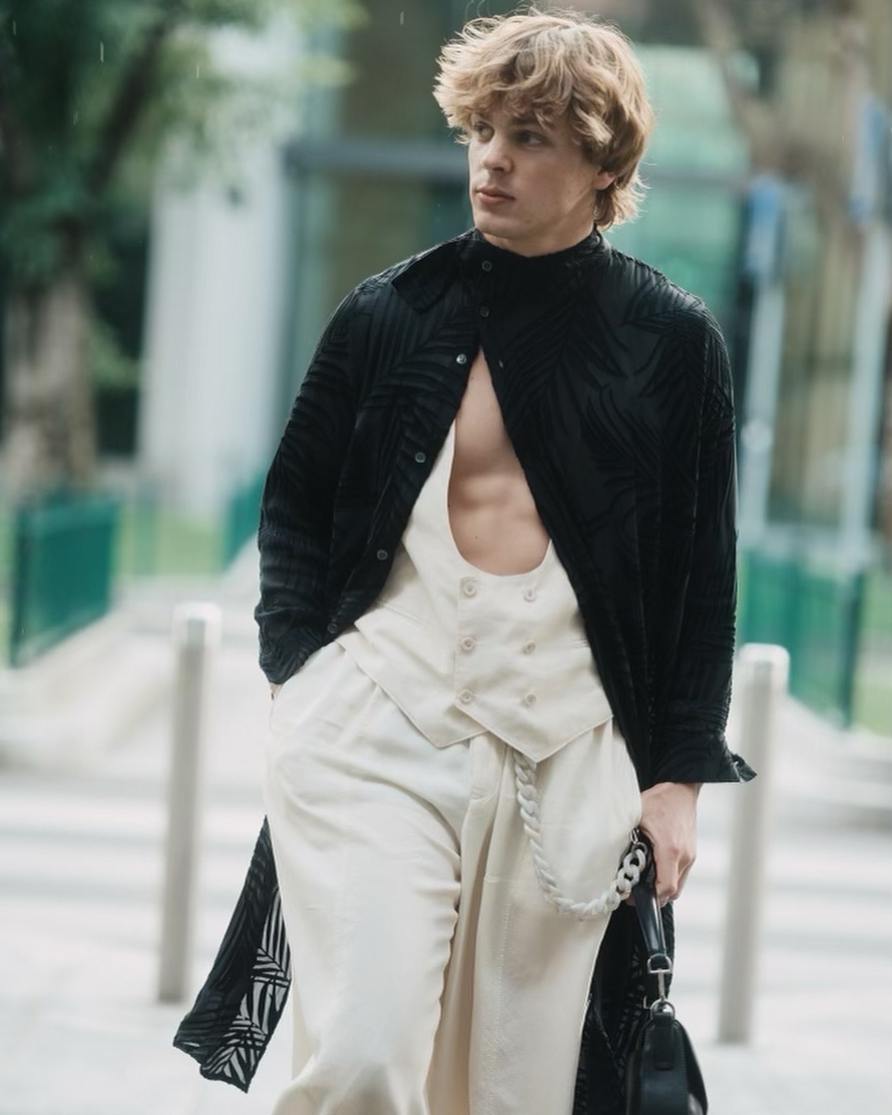 Jack Wright performing an expressive dance move on a minimalist set, capturing his athletic style and reflective tone