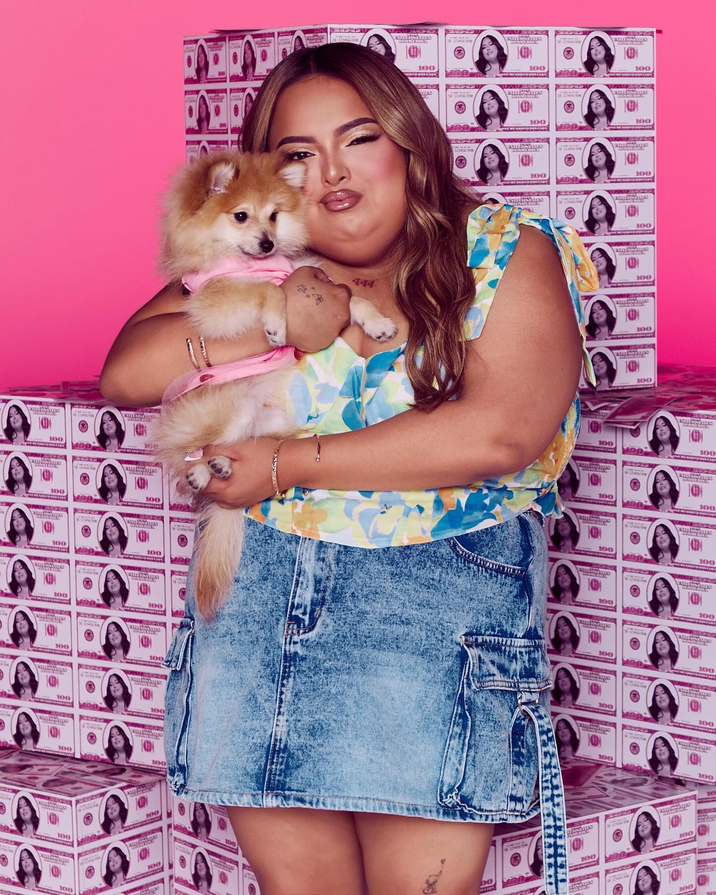 Jasmine Orlando, known as Shawty Bae, recording a short-form reaction video at home with an expressive look.