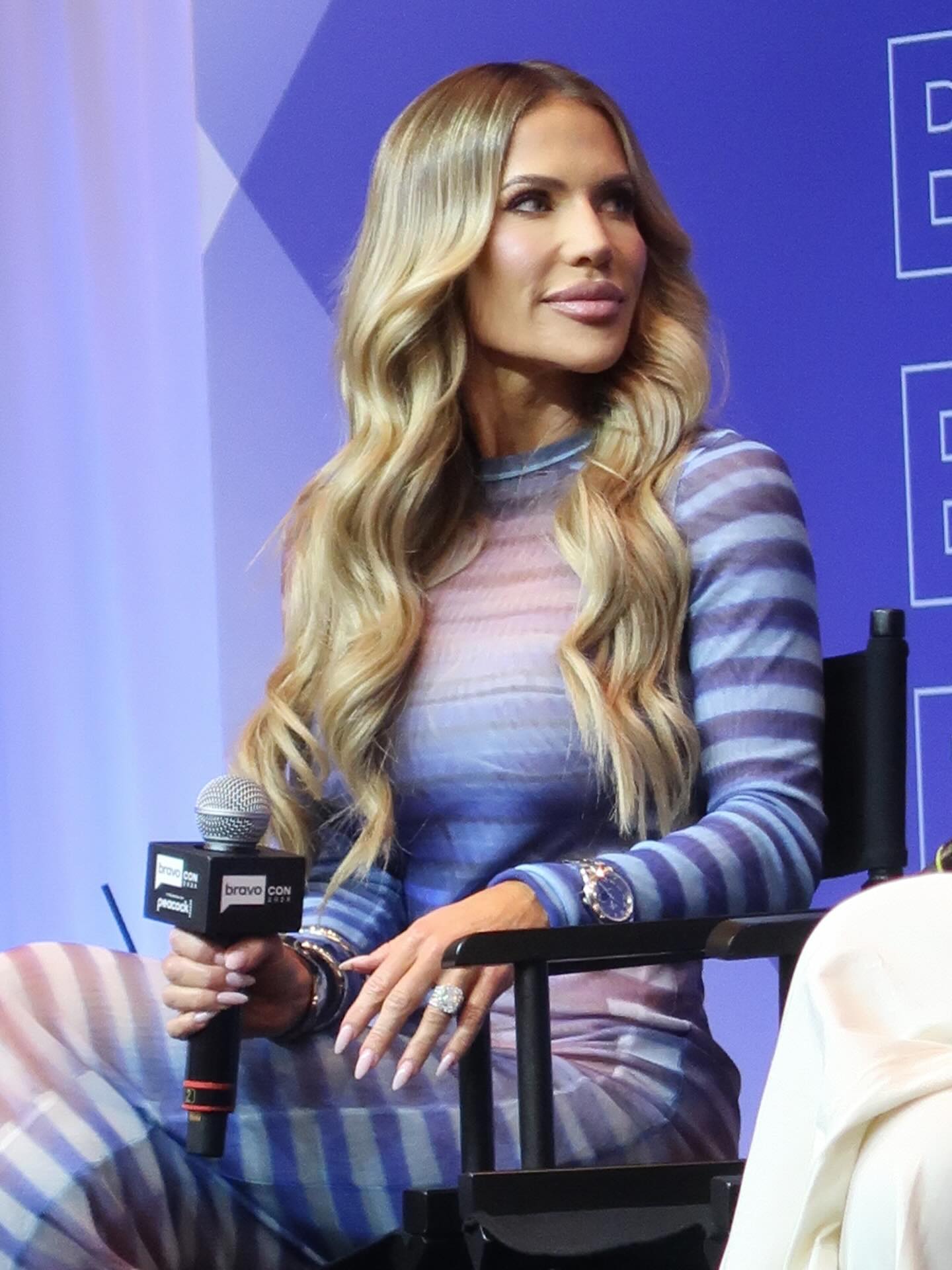 Jennifer Pedranti smiling during a relaxed moment outdoors, reflecting her blend of warmth and confidence.