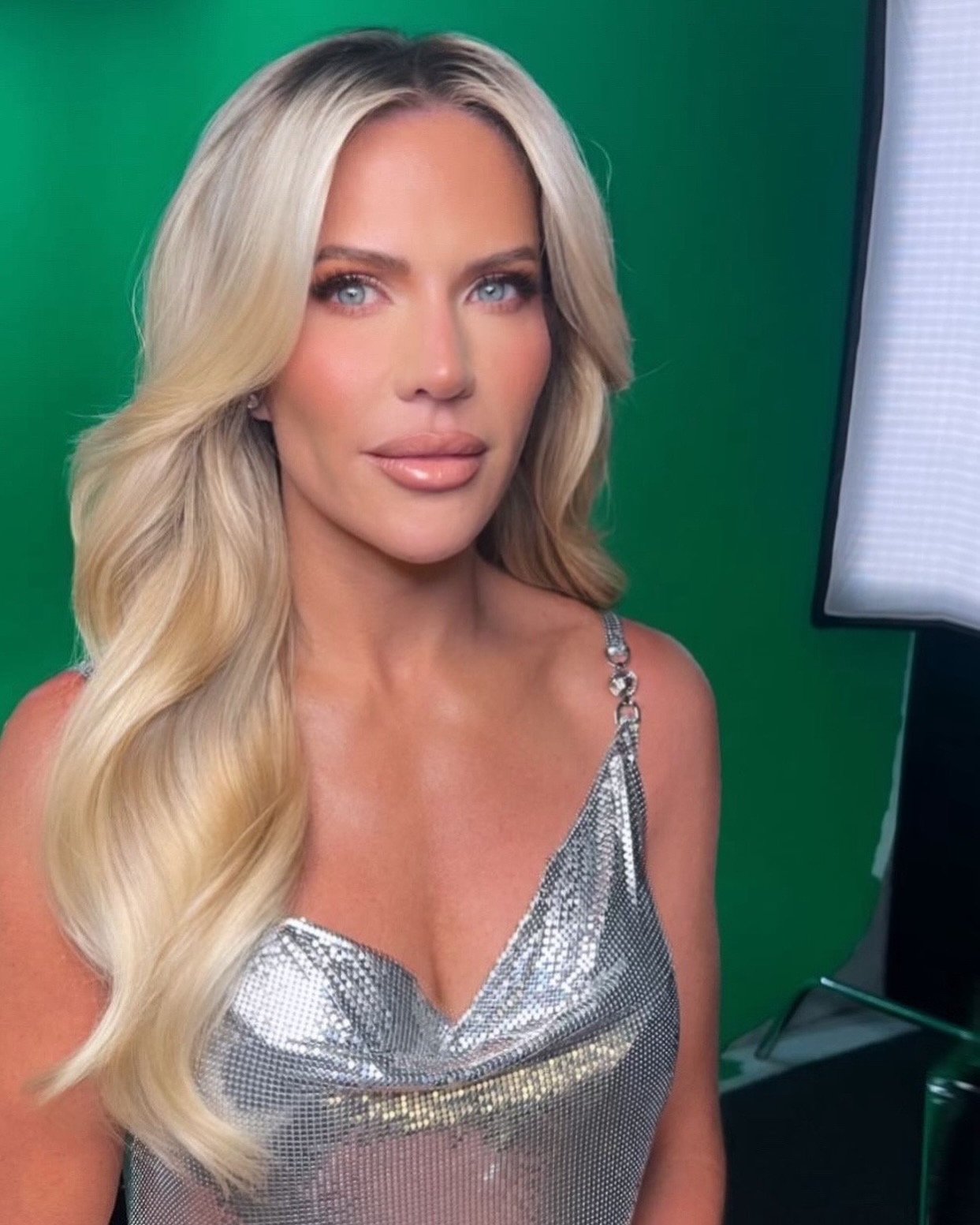 Jennifer Pedranti smiling during a relaxed moment outdoors, reflecting her blend of warmth and confidence.