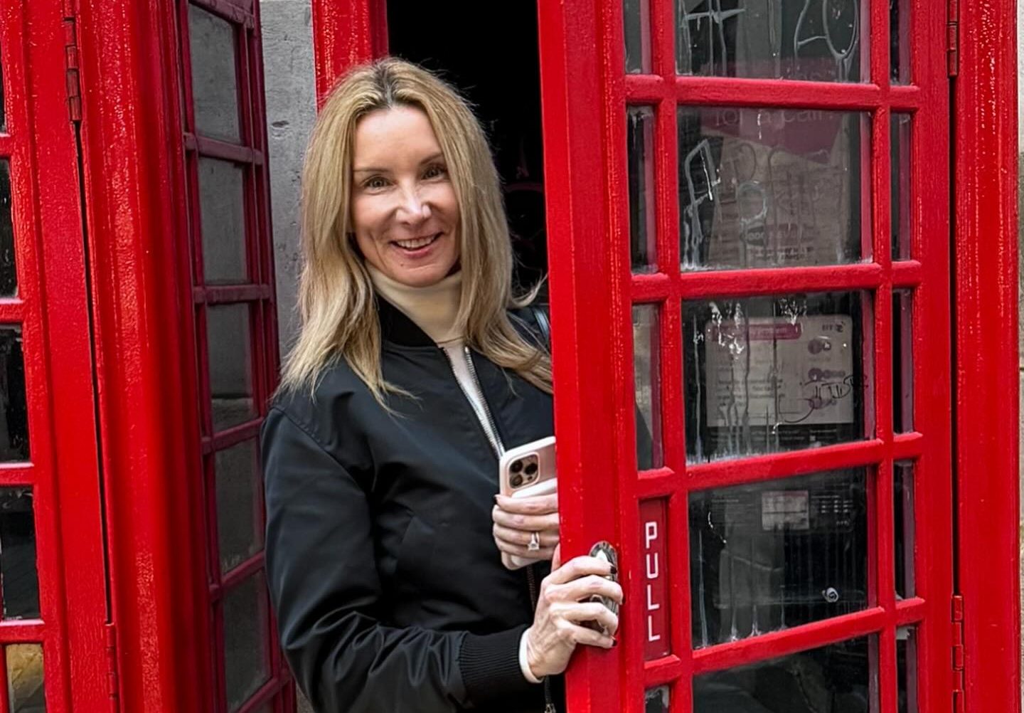 Jennifer Welch smiling with confident posture, reflecting her grounded presence in reality TV and interior design