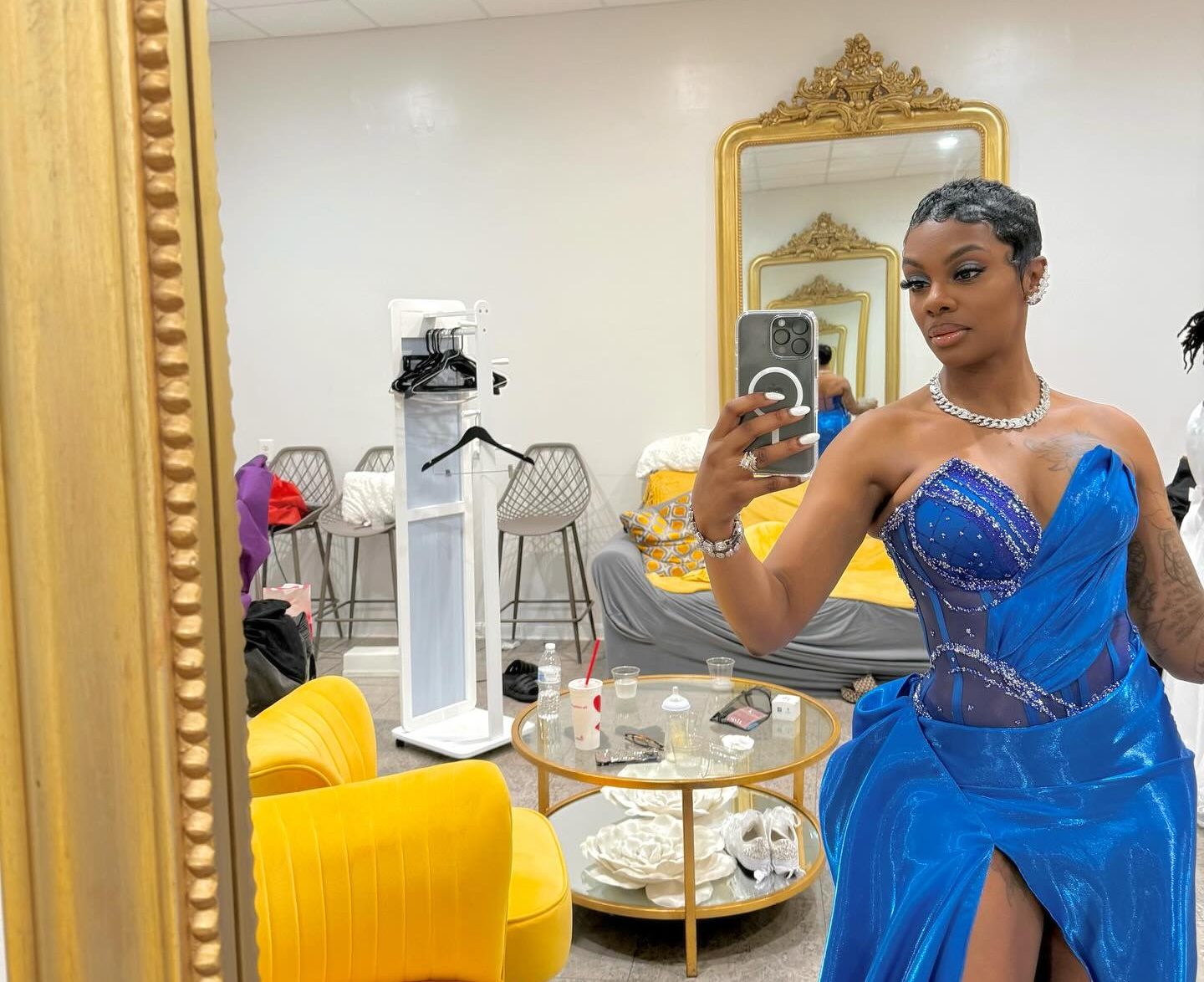 Jess Hilarious performing on stage, delivering a high energy set with expressive gestures.