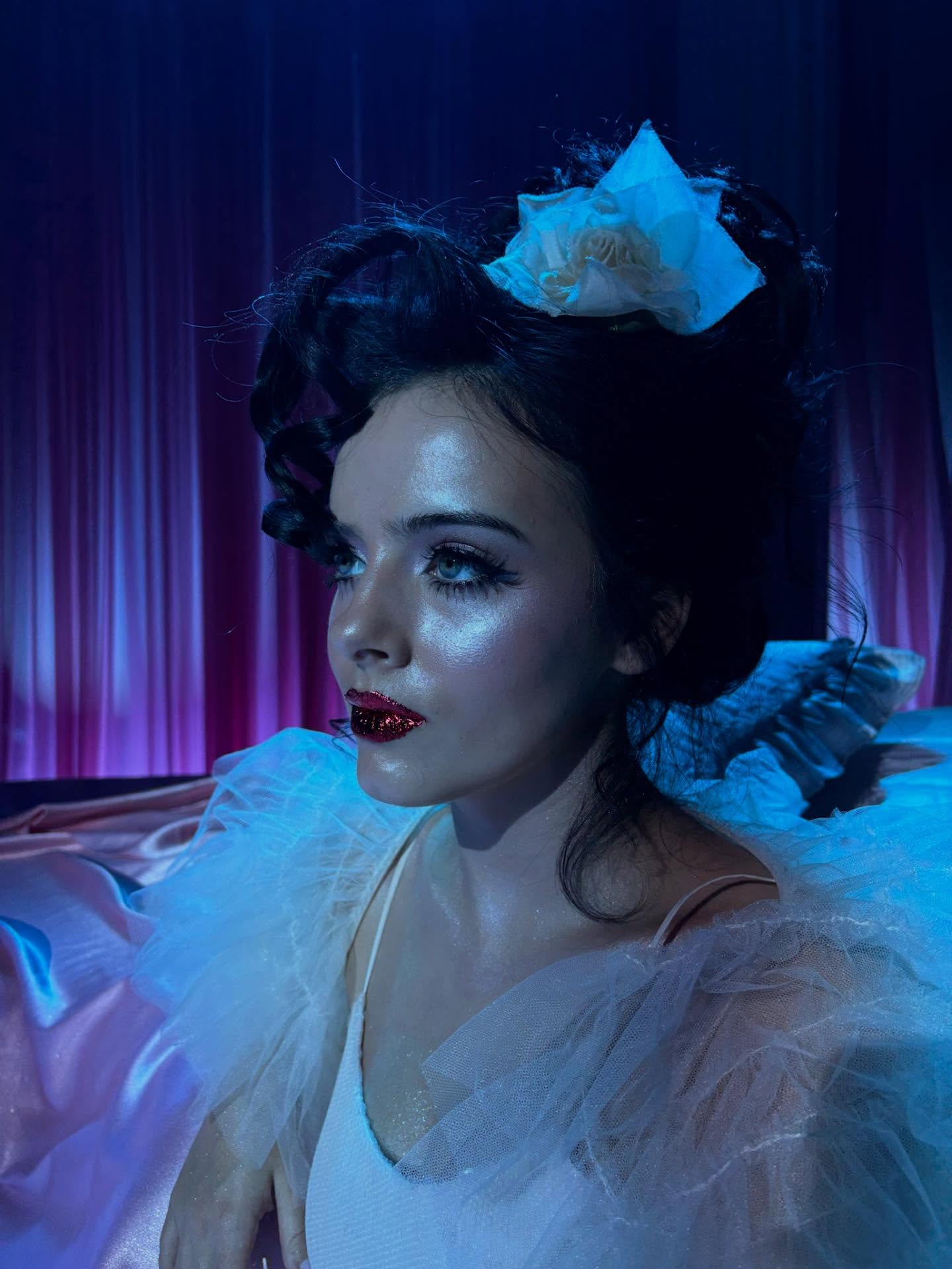 Jessie Murph performing on stage, captured mid-song with expressive lighting that reflects the emotional tone of her music