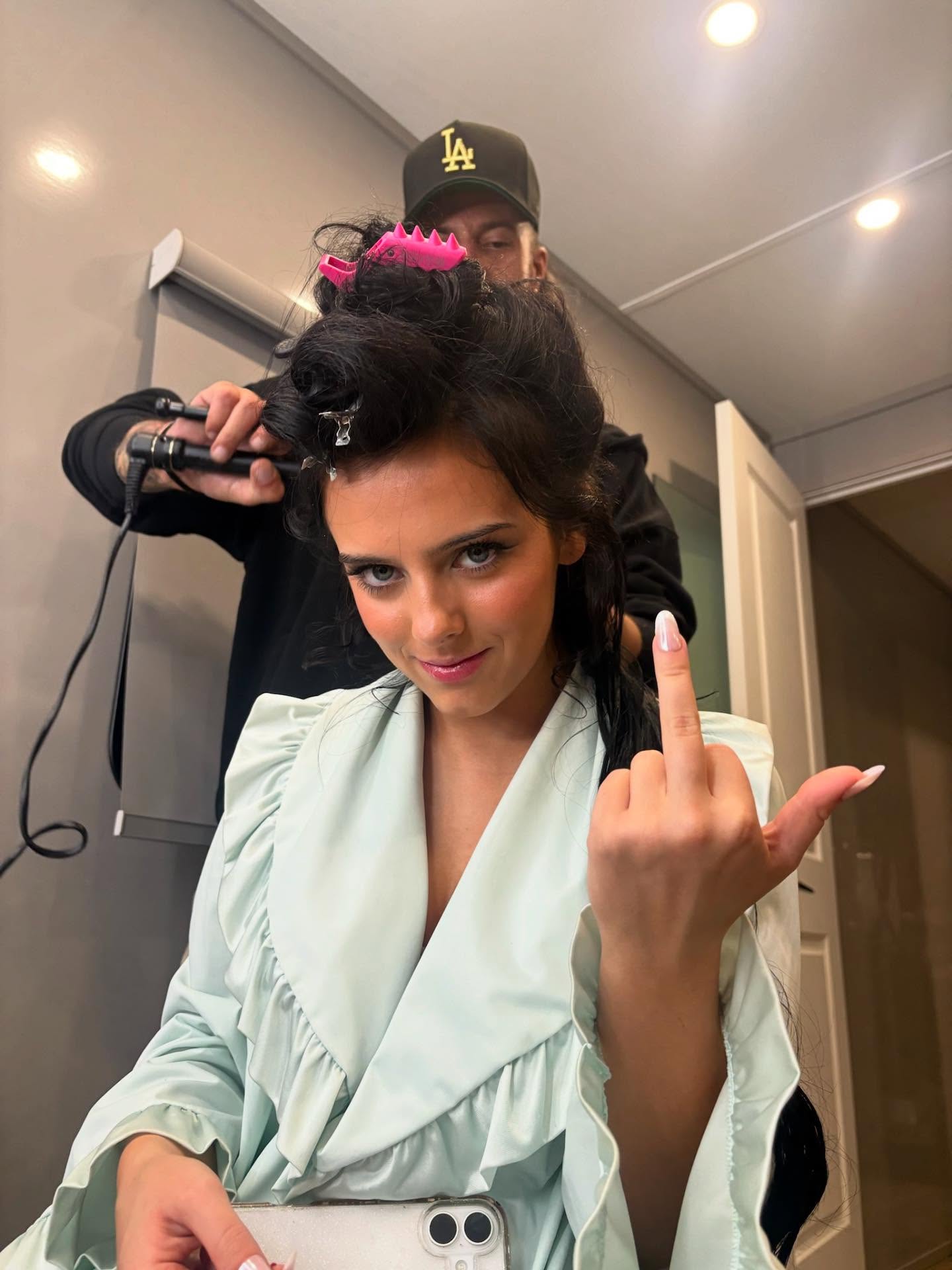 Jessie Murph performing on stage, captured mid-song with expressive lighting that reflects the emotional tone of her music