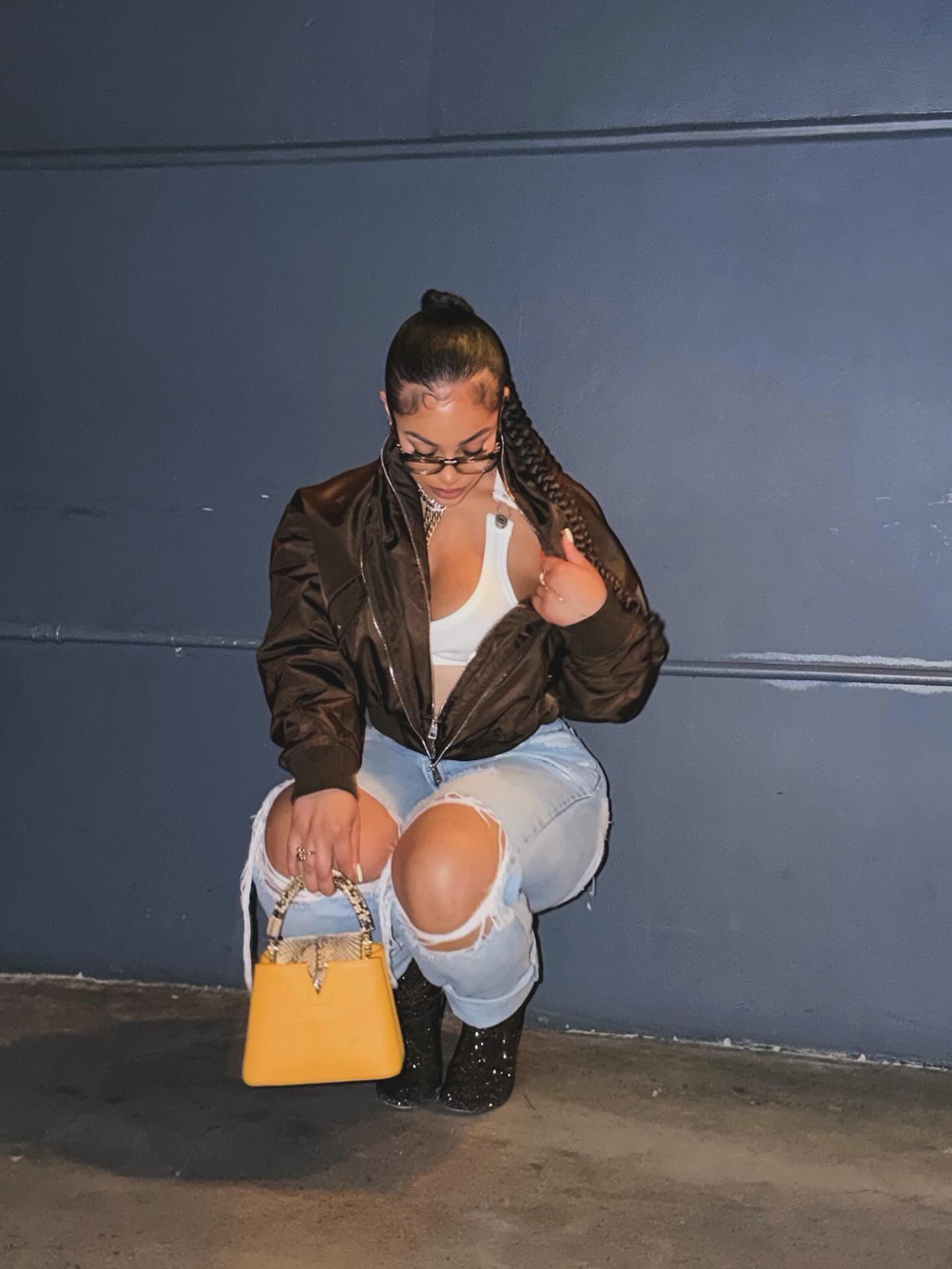 Joie Chavis in a poised dance stance, conveying strength, focus, and grace.