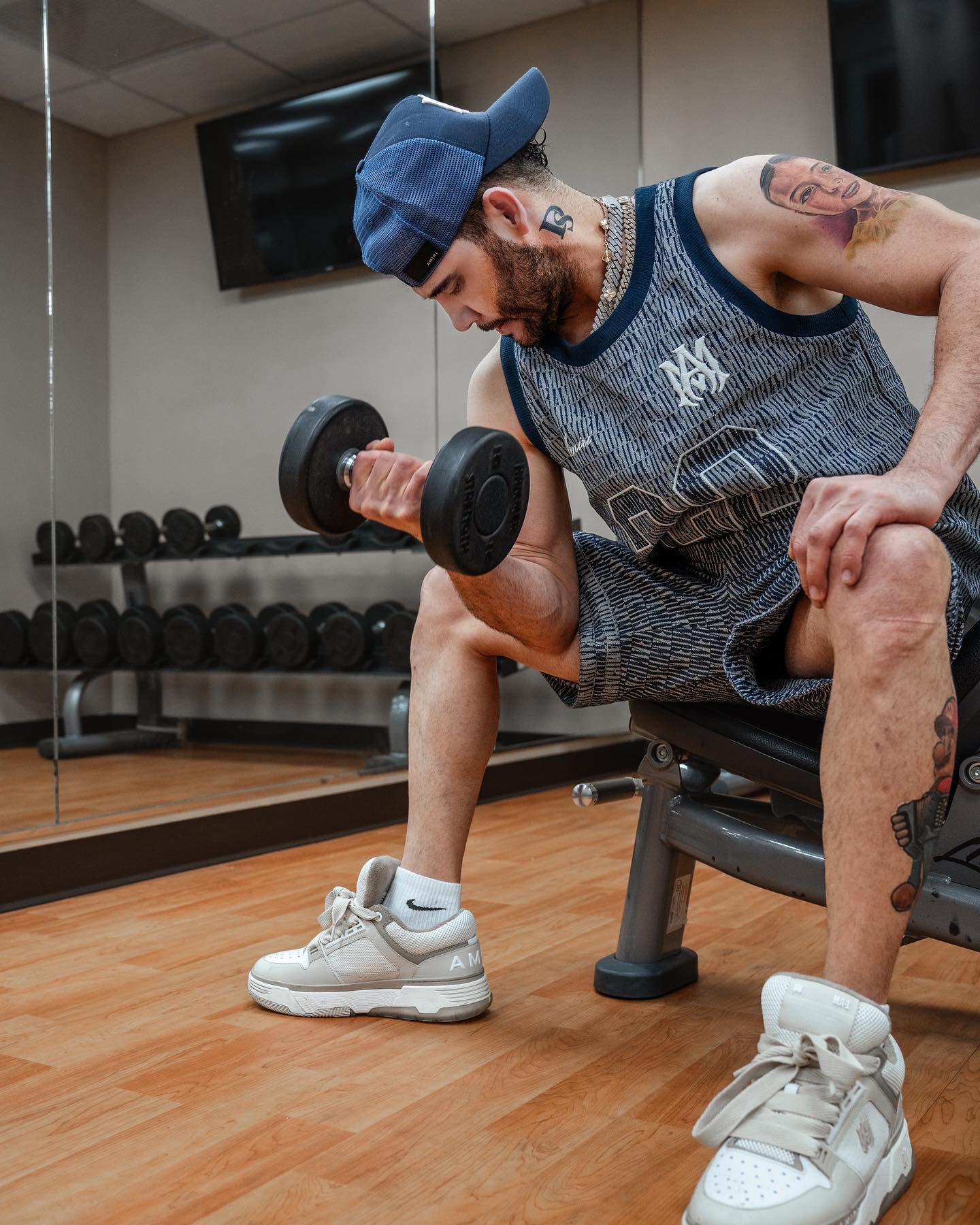 José Darey Castro performing onstage with an accordion, spotlighted against a backdrop that reflects Sonoran norteño heritage