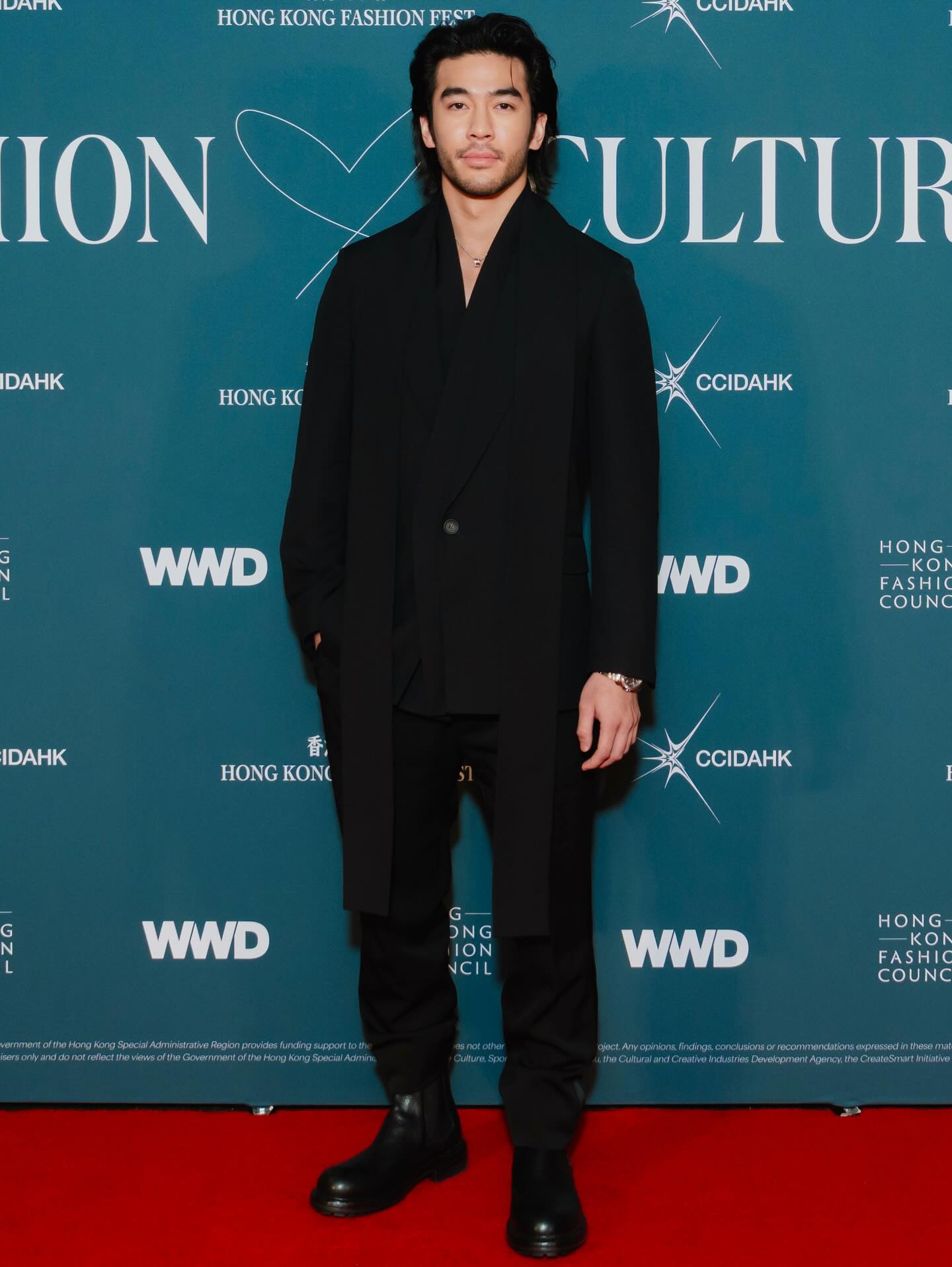 Justin Chien on set, composed and focused, reflecting his restrained screen presence and disciplined approach to roles