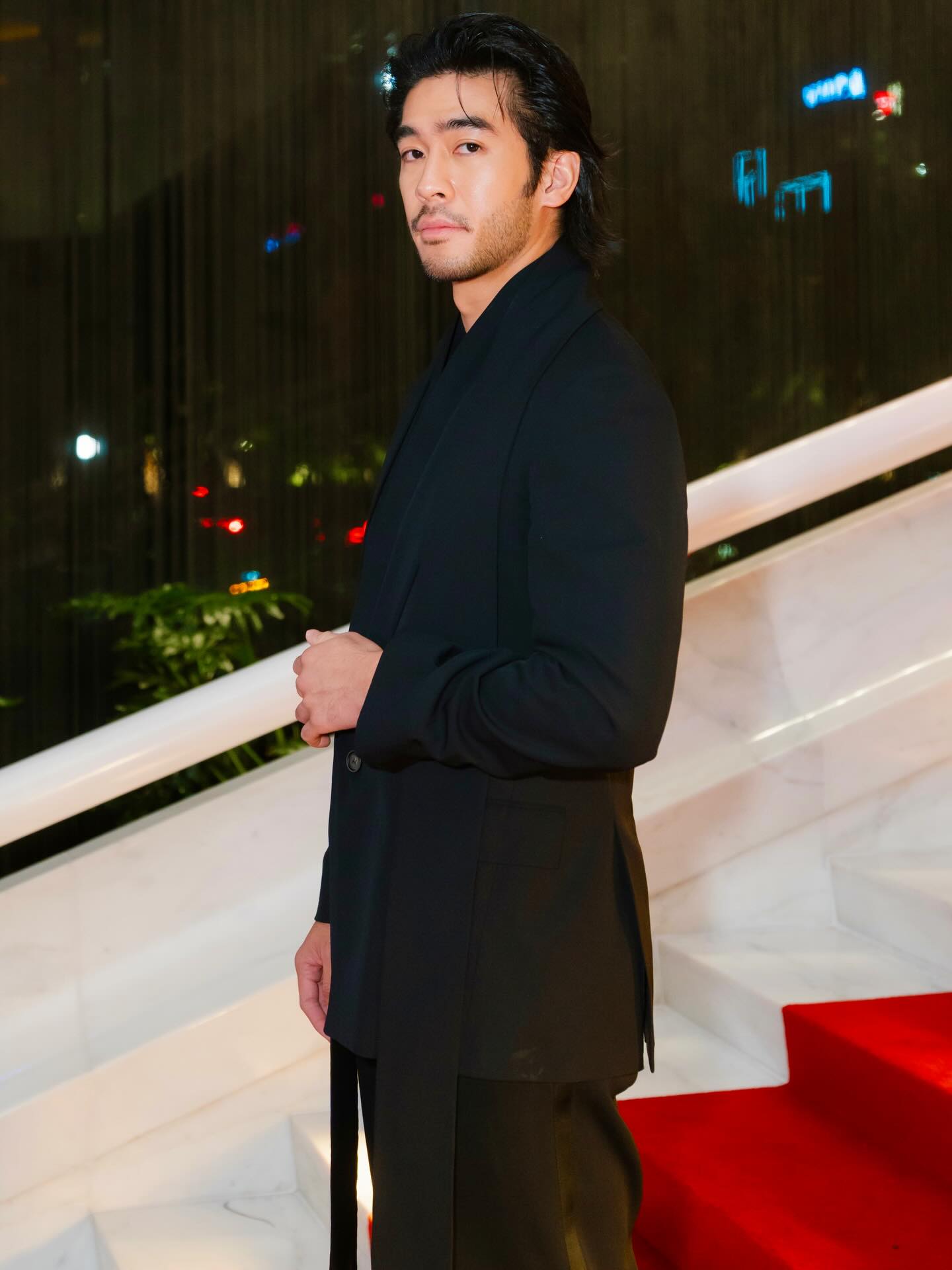 Justin Chien on set, composed and focused, reflecting his restrained screen presence and disciplined approach to roles