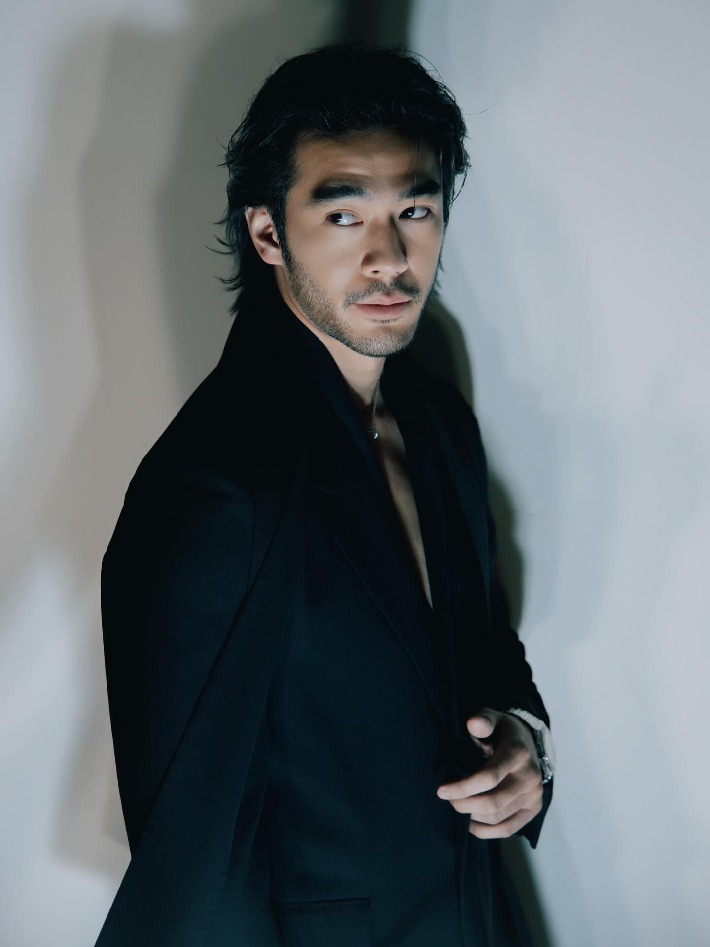 Justin Chien on set, composed and focused, reflecting his restrained screen presence and disciplined approach to roles