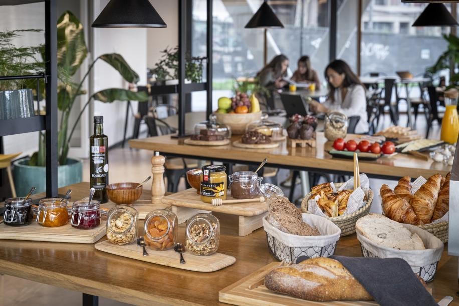 A simple name card reading Kora Green placed on a neutral desk, softly lit to evoke quiet recognition and respectful curiosity