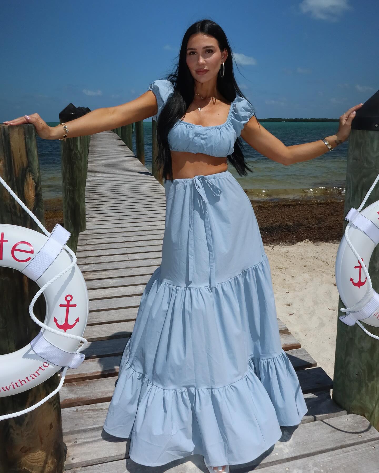 Krystiana Tiana smiling with her family in a cozy home setting, capturing the warm and relatable atmosphere that defines her content