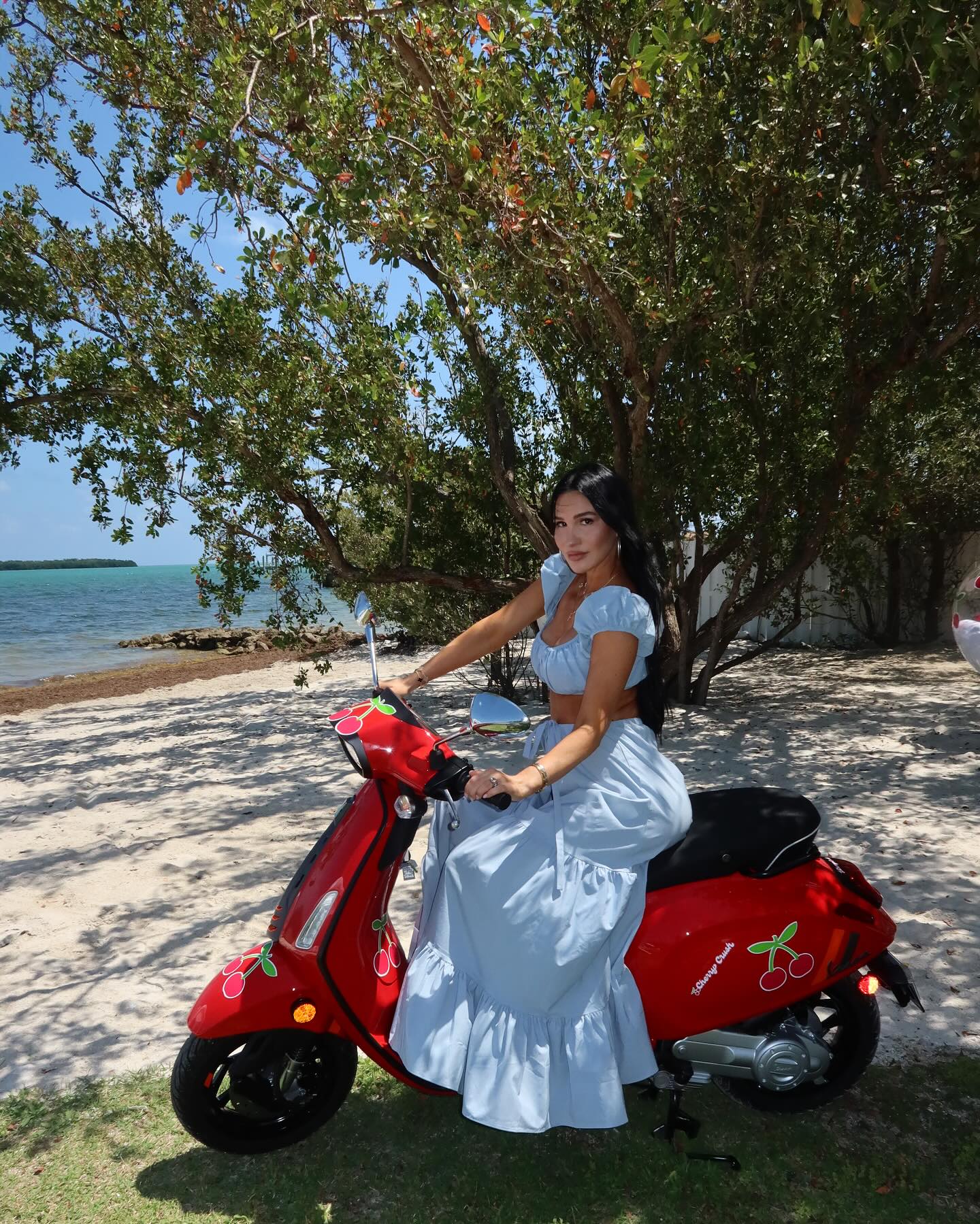 Krystiana Tiana smiling with her family in a cozy home setting, capturing the warm and relatable atmosphere that defines her content
