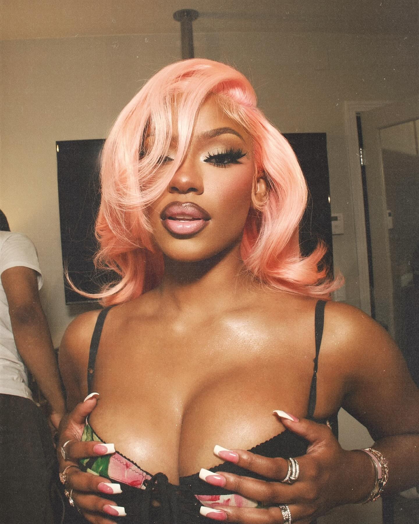 Monaleo performing on stage, delivering an energetic rap set with confident presence