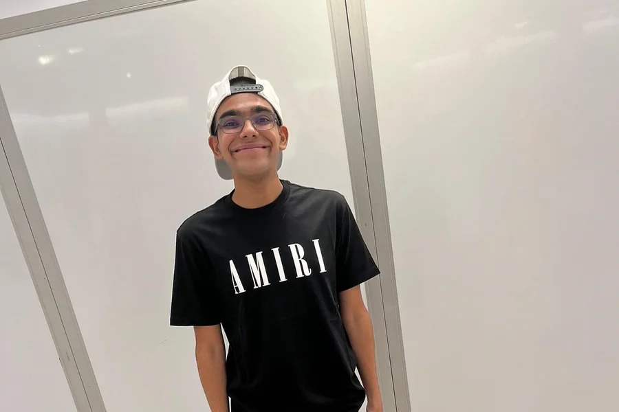 N3ON, also known as Rangesh Mutama, livestreaming from a gaming setup with expressive reactions and a bright on-screen overlay