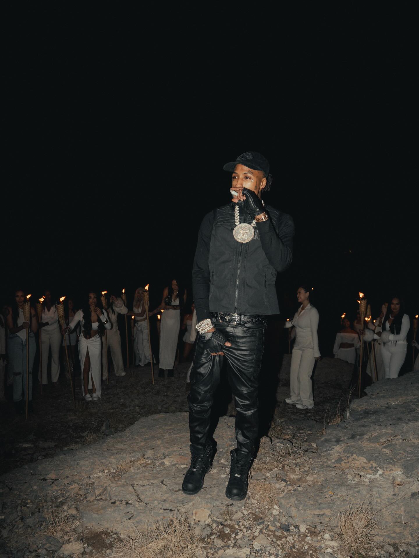 NBA YoungBoy performing on stage with expressive energy, capturing the intensity and emotion that define his music.