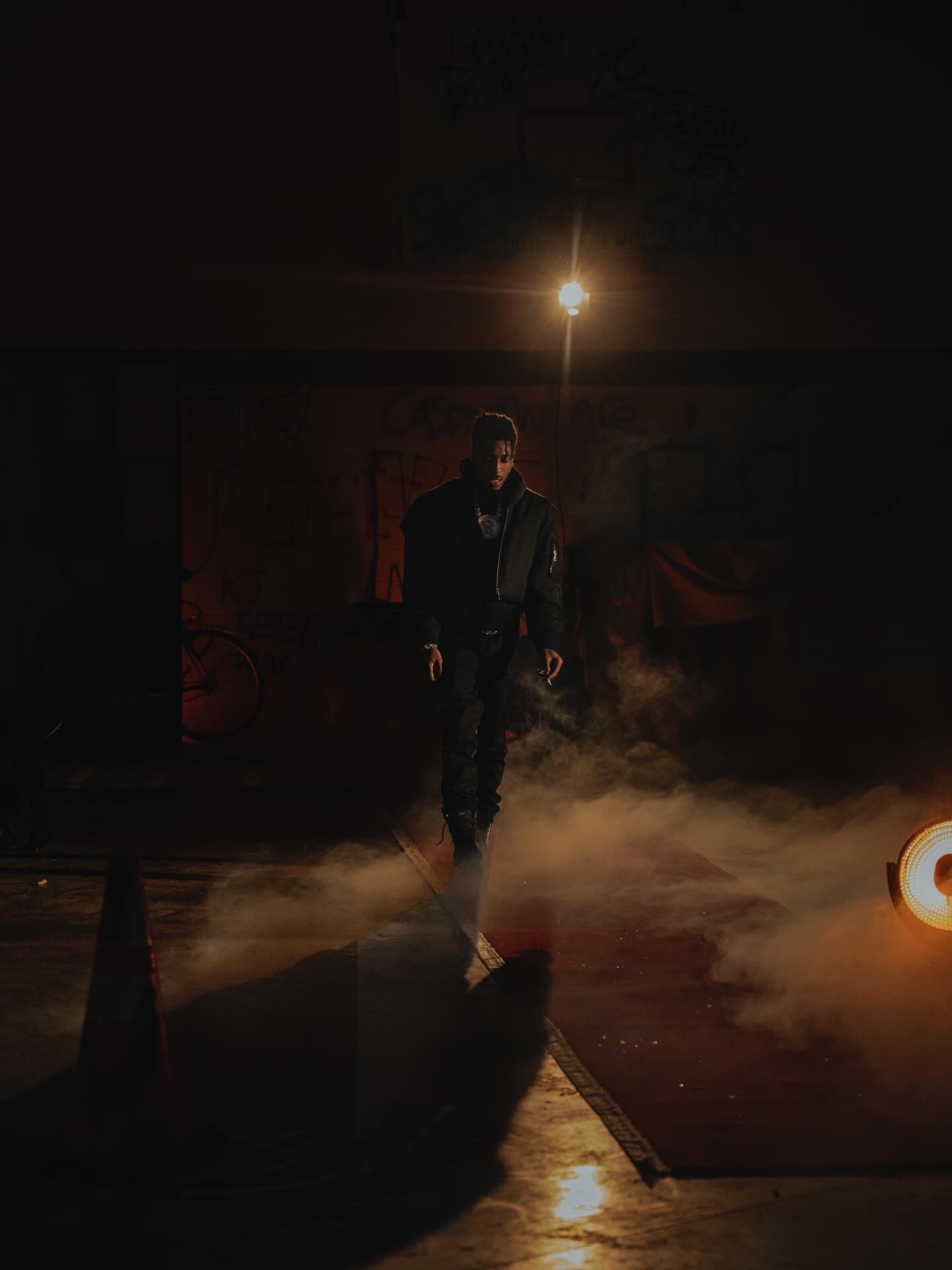 NBA YoungBoy performing on stage with expressive energy, capturing the intensity and emotion that define his music.