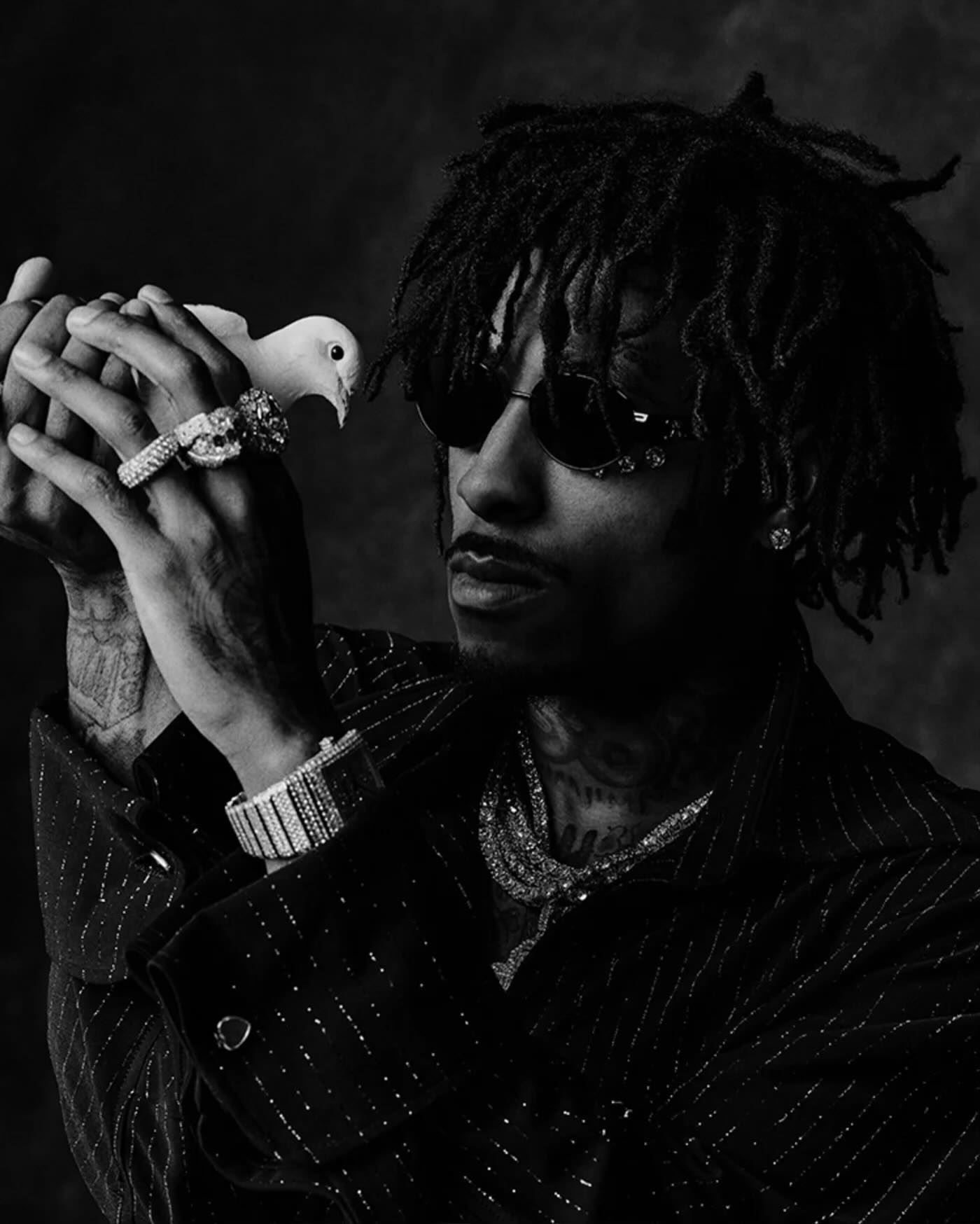 NBA YoungBoy performing on stage with expressive energy, capturing the intensity and emotion that define his music.