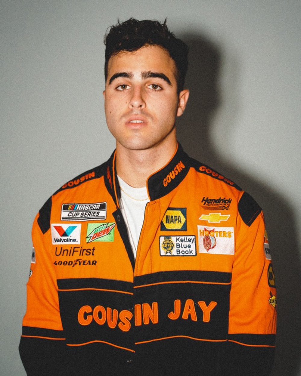 Nick Nayersina filming a vlog outdoors with a handheld camera