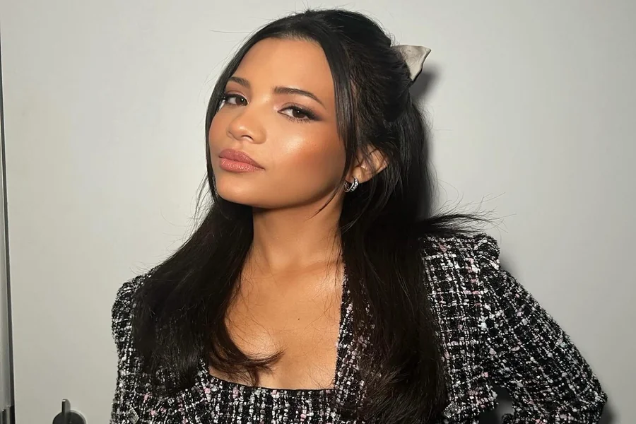 Nikki Rodriguez at a studio portrait session, poised and smiling with a calm, confident expression