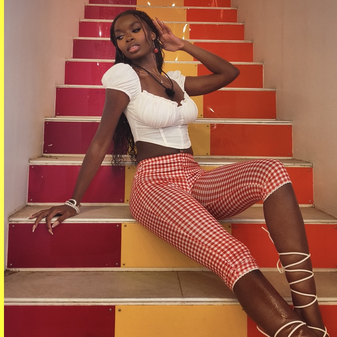 Olandria Carthen poses with a confident smile, reflecting her Alabama roots and polished style.