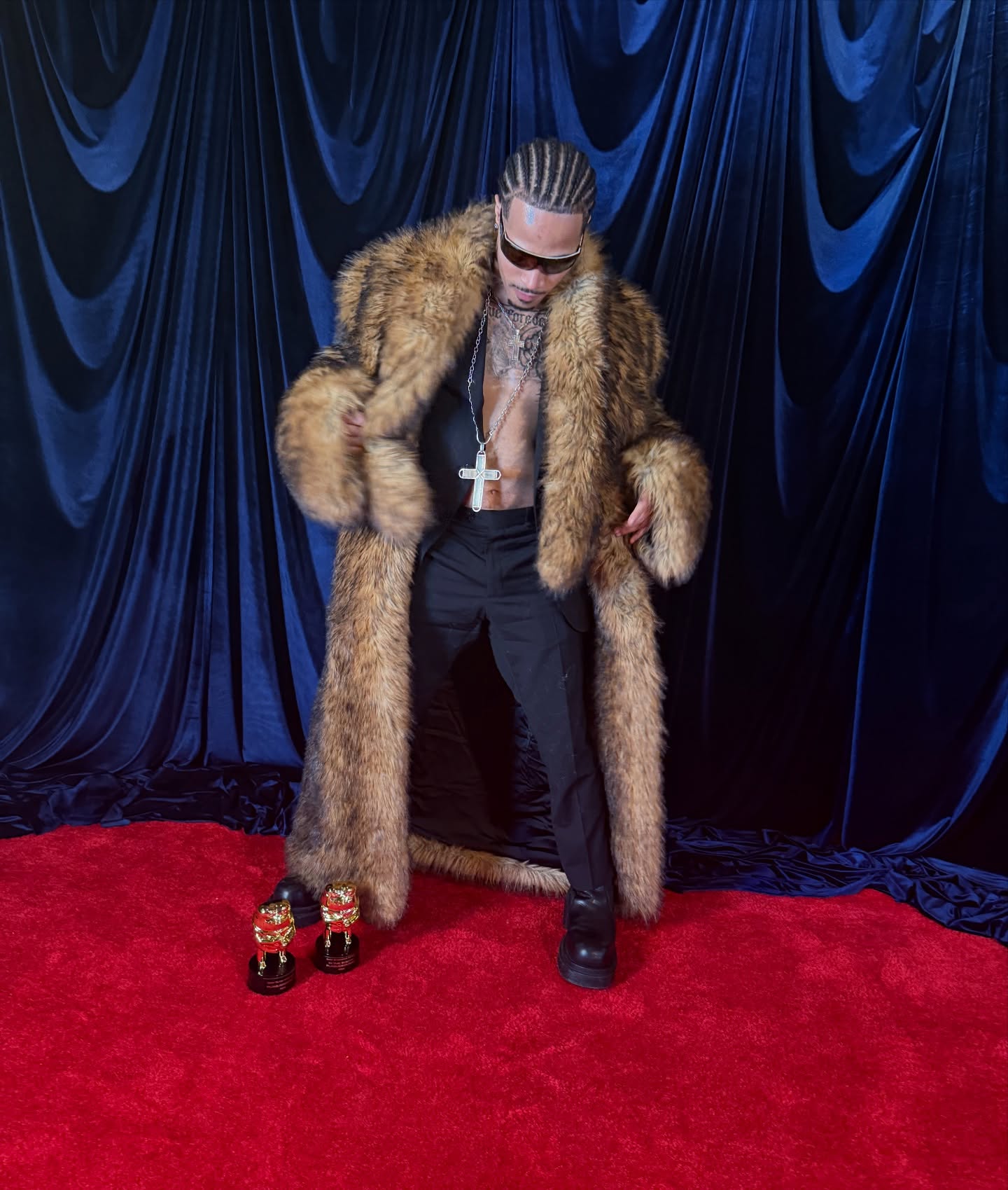 Plaqueboymax streaming at a desk with music production gear, microphone, and chat window visible on screen