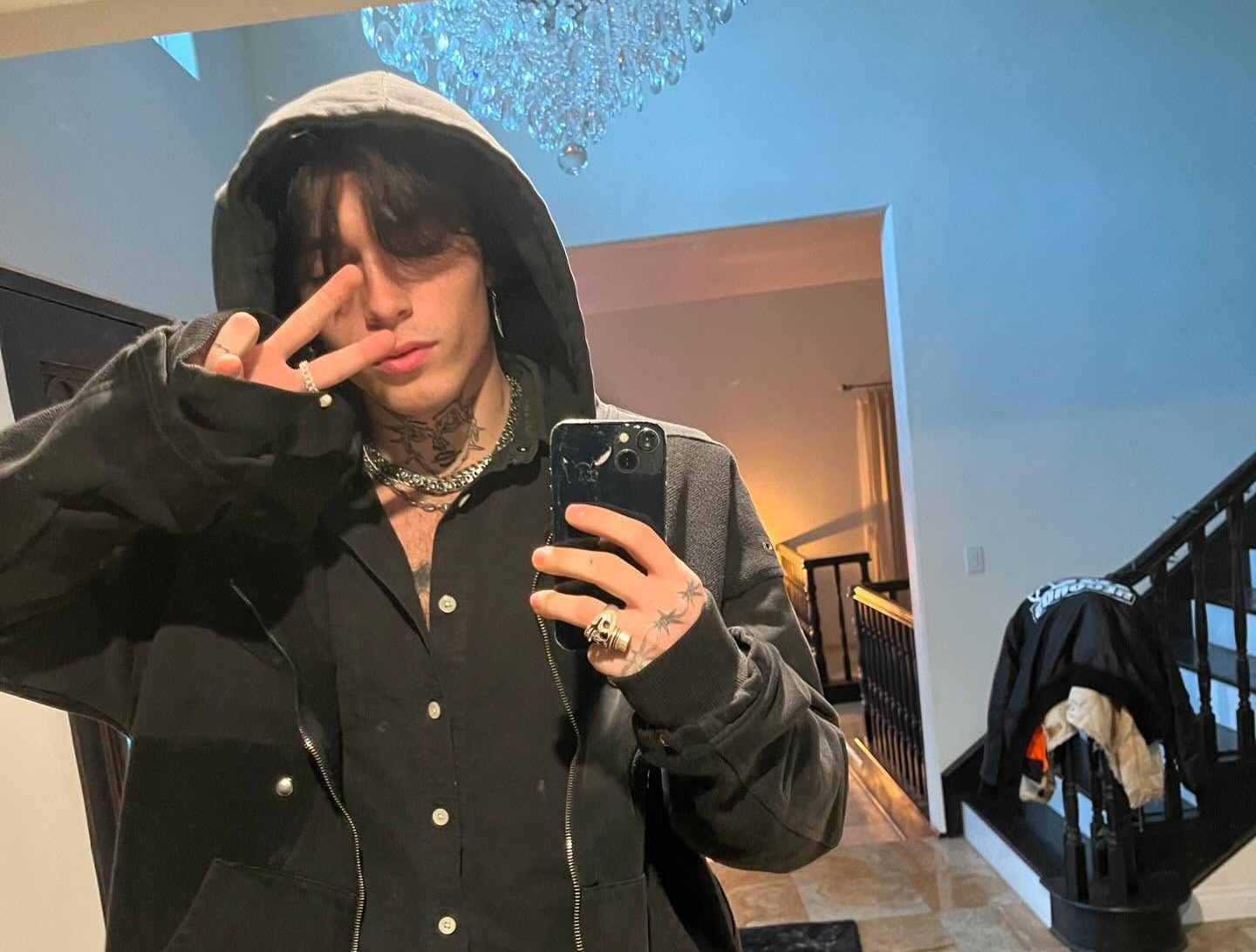 Quinton Griggs performing on stage with moody lighting, showcasing his transition from social media creator to recording artist