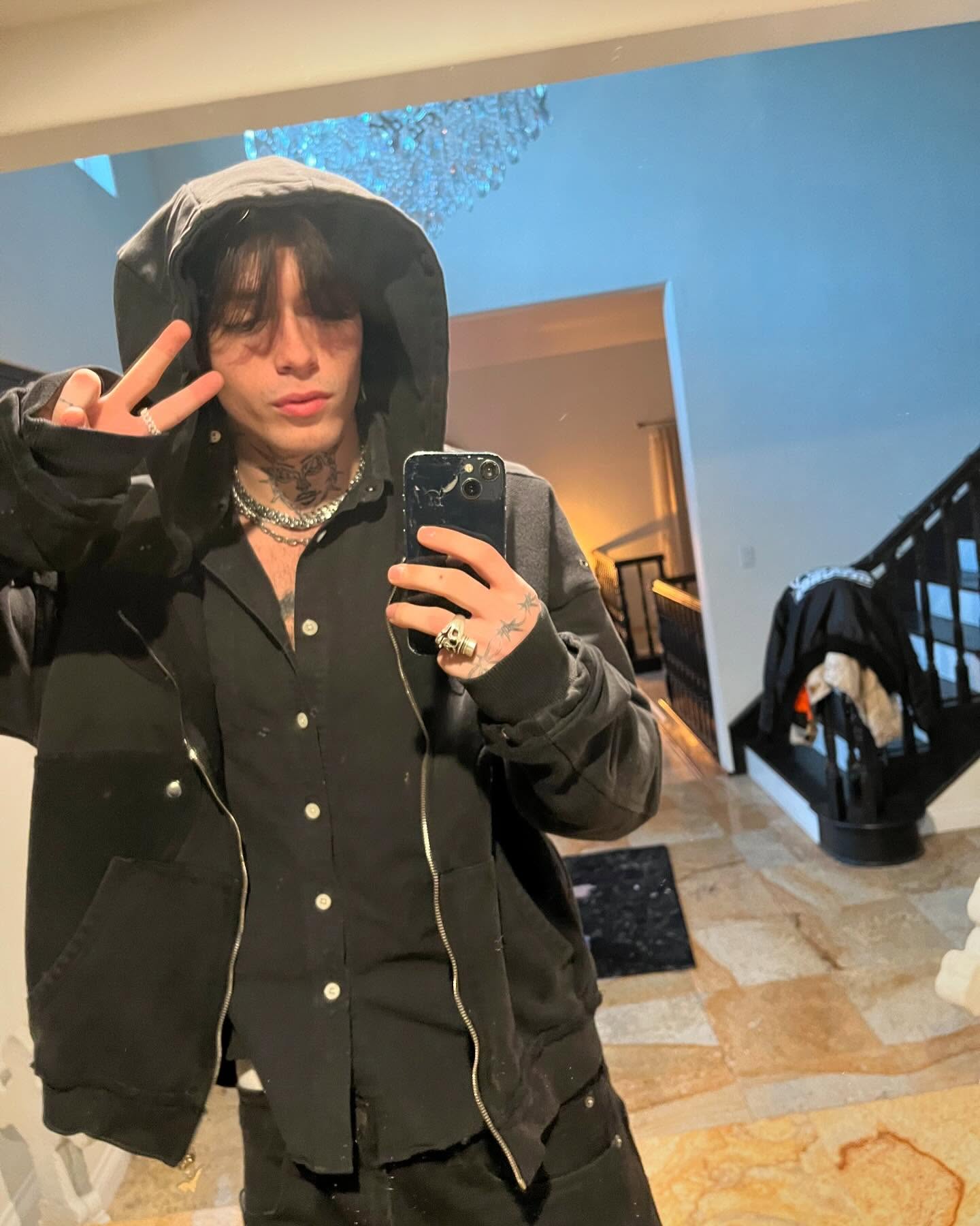 Quinton Griggs performing on stage with moody lighting, showcasing his transition from social media creator to recording artist