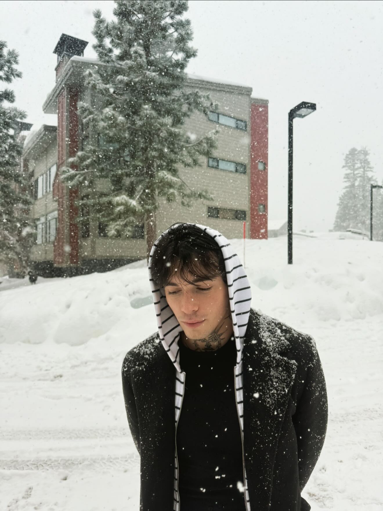 Quinton Griggs performing on stage with moody lighting, showcasing his transition from social media creator to recording artist