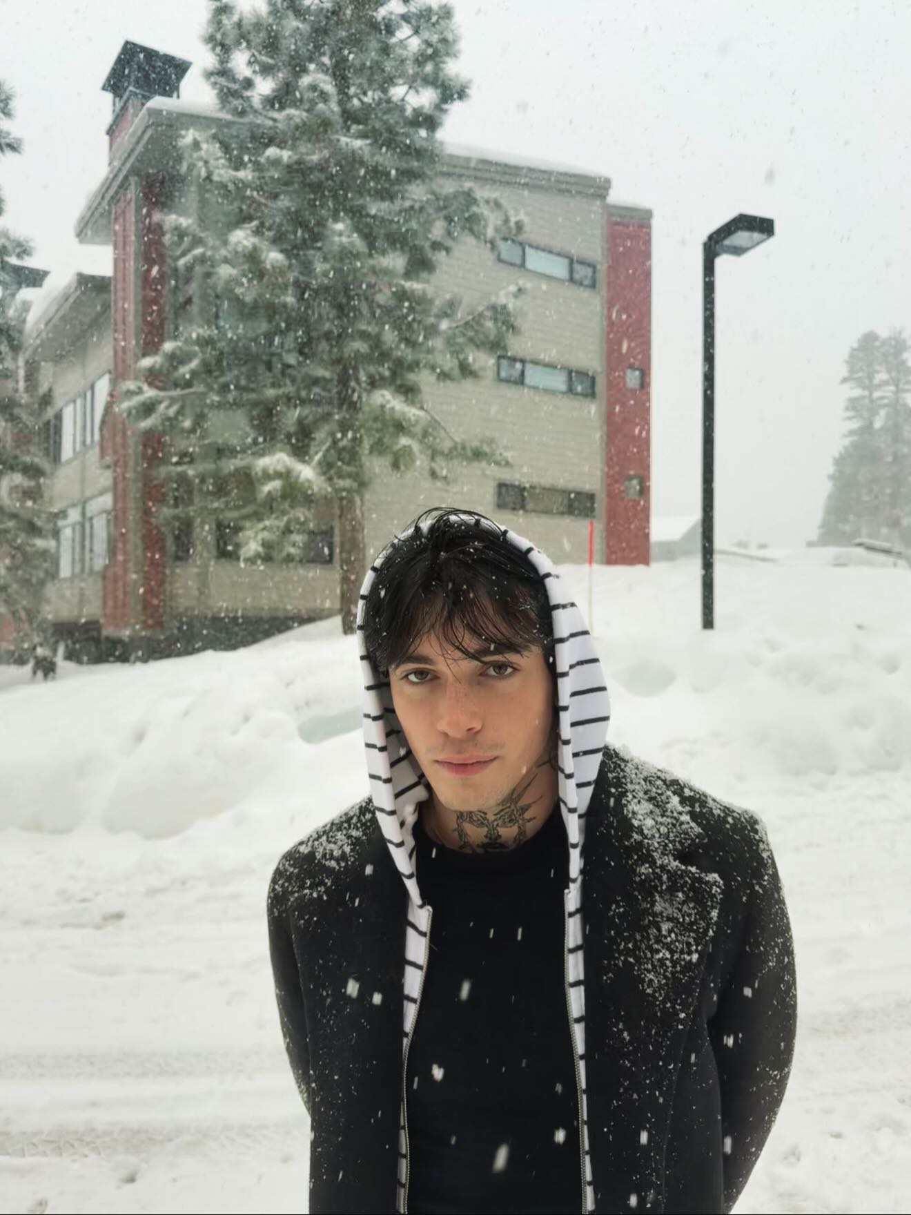 Quinton Griggs performing on stage with moody lighting, showcasing his transition from social media creator to recording artist