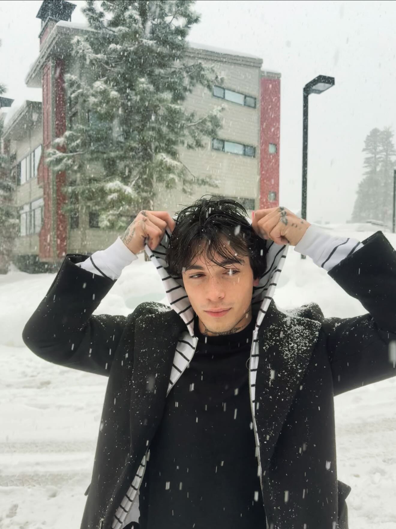 Quinton Griggs performing on stage with moody lighting, showcasing his transition from social media creator to recording artist