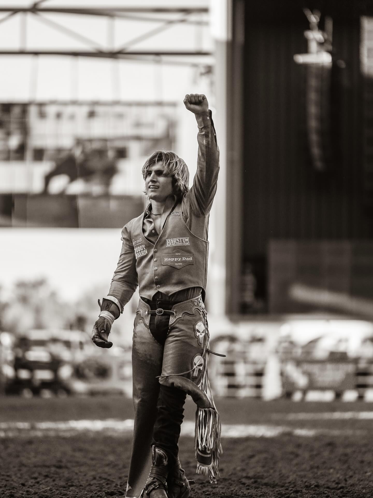 Rocker Steiner rides a bareback bronc, legs driving in rhythm as the horse kicks in midair, capturing the power and balance of modern rodeo.