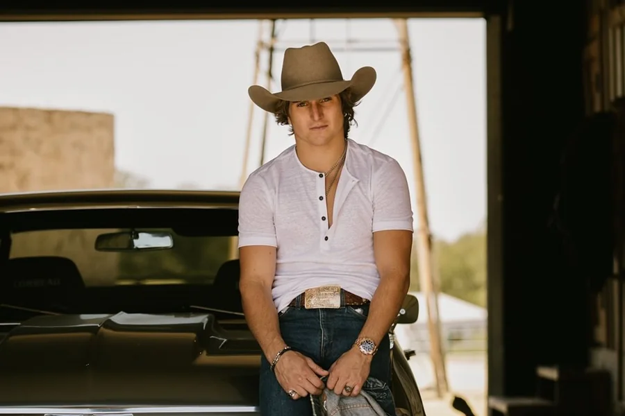 Rocker Steiner rides a bareback bronc, legs driving in rhythm as the horse kicks in midair, capturing the power and balance of modern rodeo.