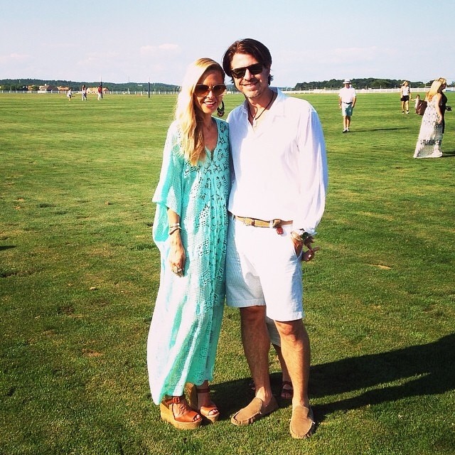 Rodger Berman at a fashion media event, dressed in a tailored suit, speaking with confidence in a professional setting